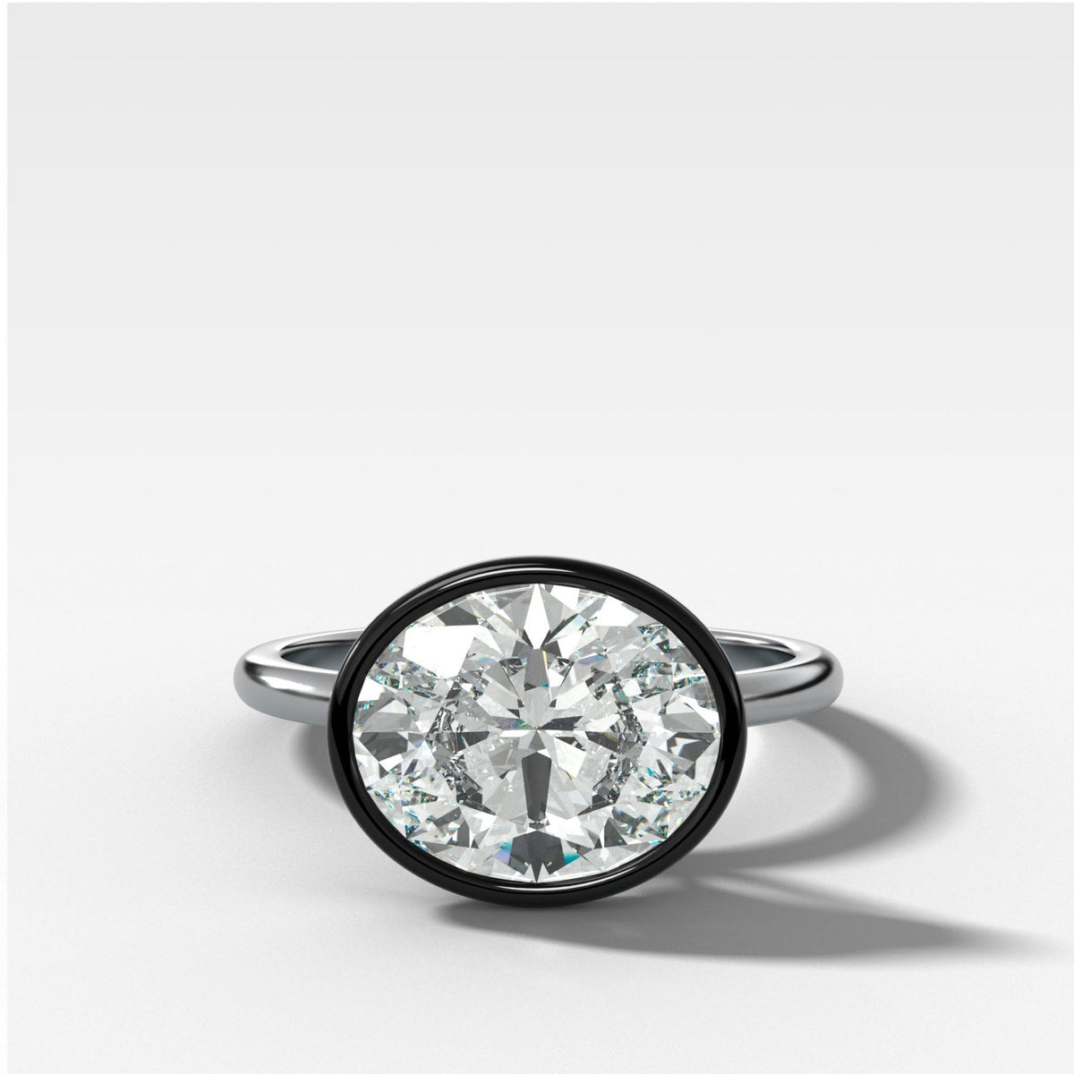 Blackened Penumbra Bezel Set Engagement Ring With East West Oval Cut - GOODSTONE