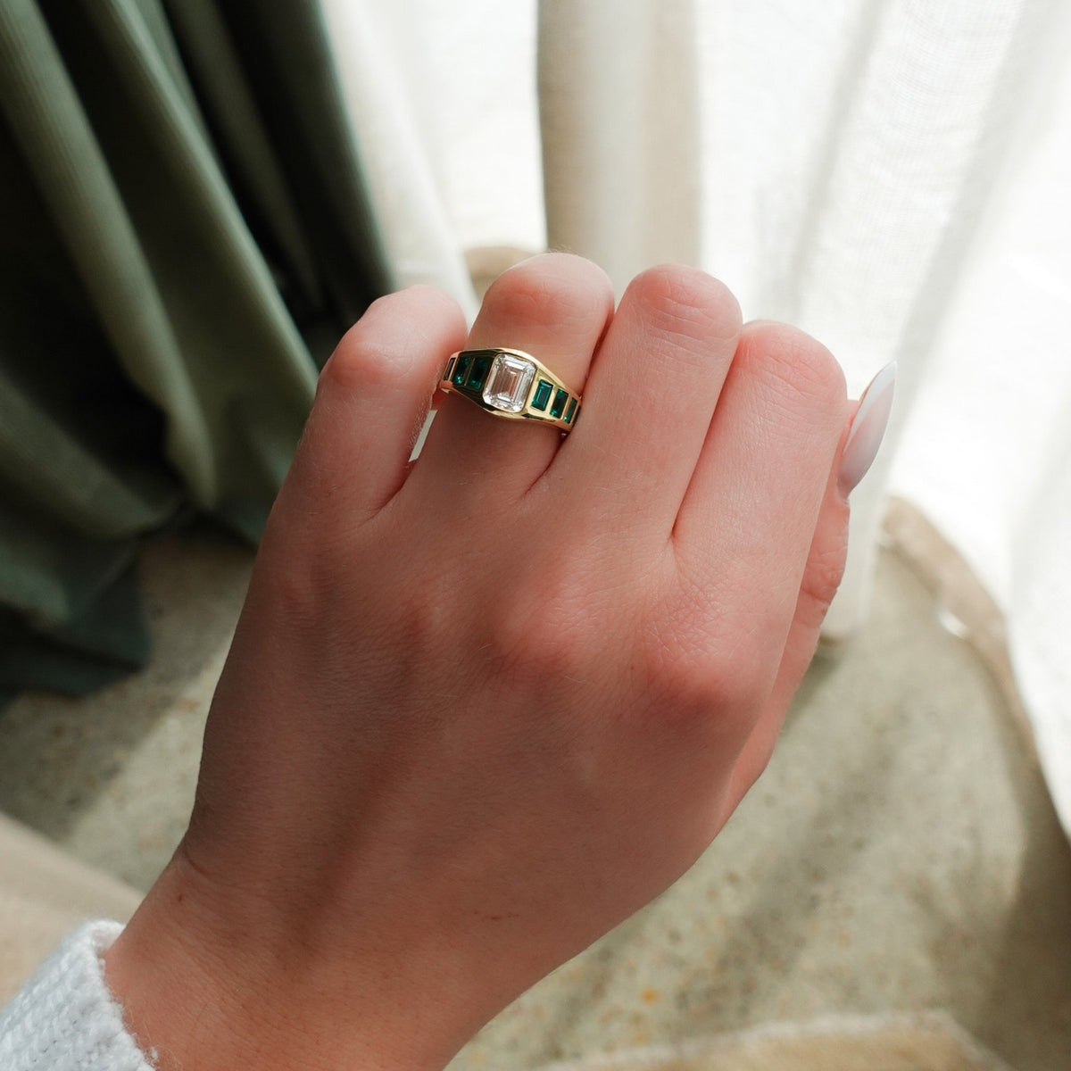 Brick Road Engagement Ring with Green Emeralds and an Emerald Cut - GOODSTONE