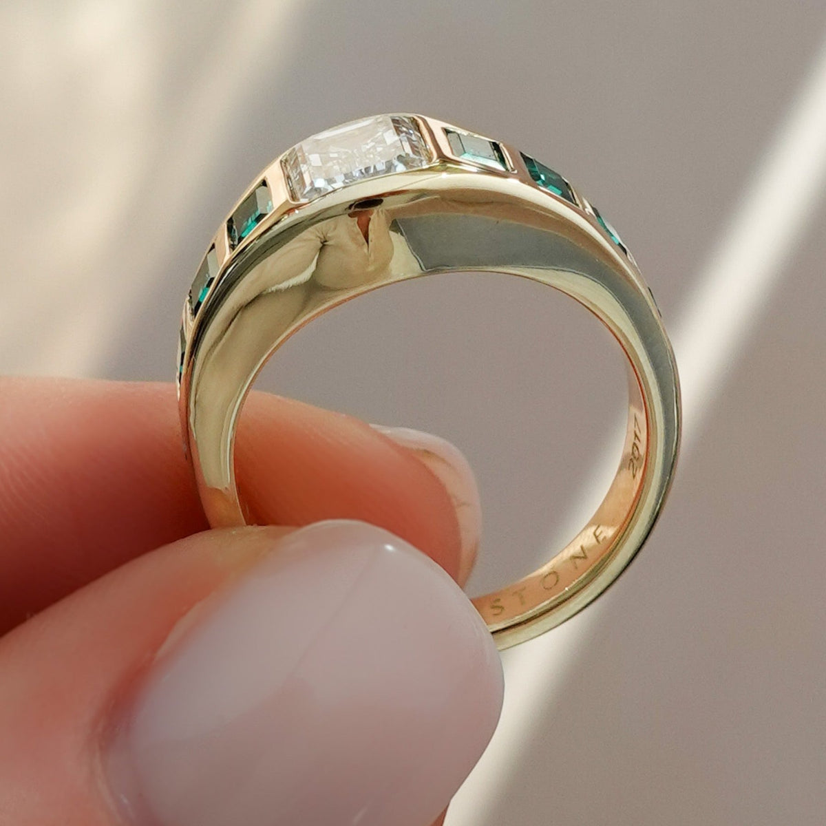 Brick Road Engagement Ring with Green Emeralds and an Emerald Cut - GOODSTONE