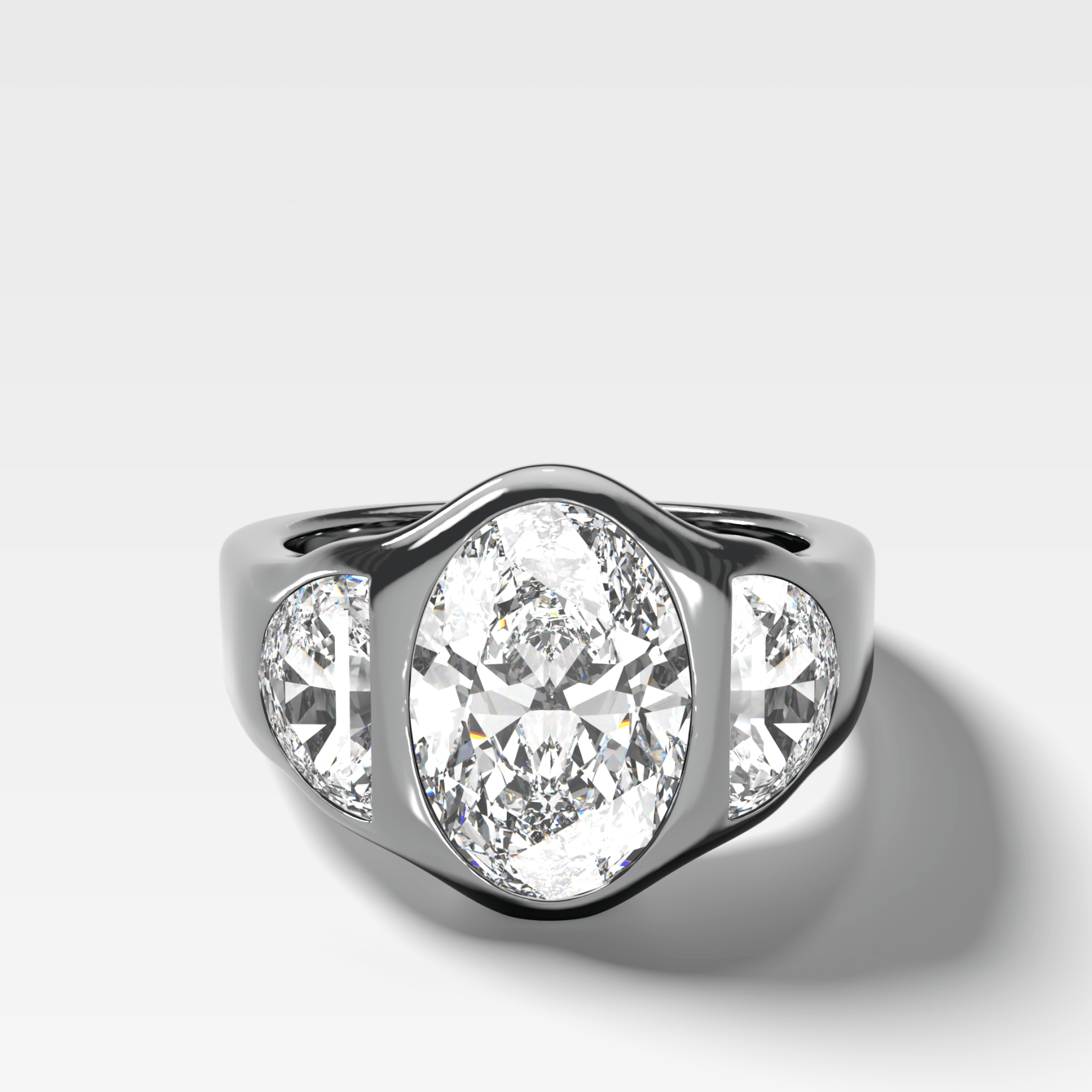 Burnished Three Stone Engagement Ring with Half Moon Sides & Oval Cut Diamond - GOODSTONE