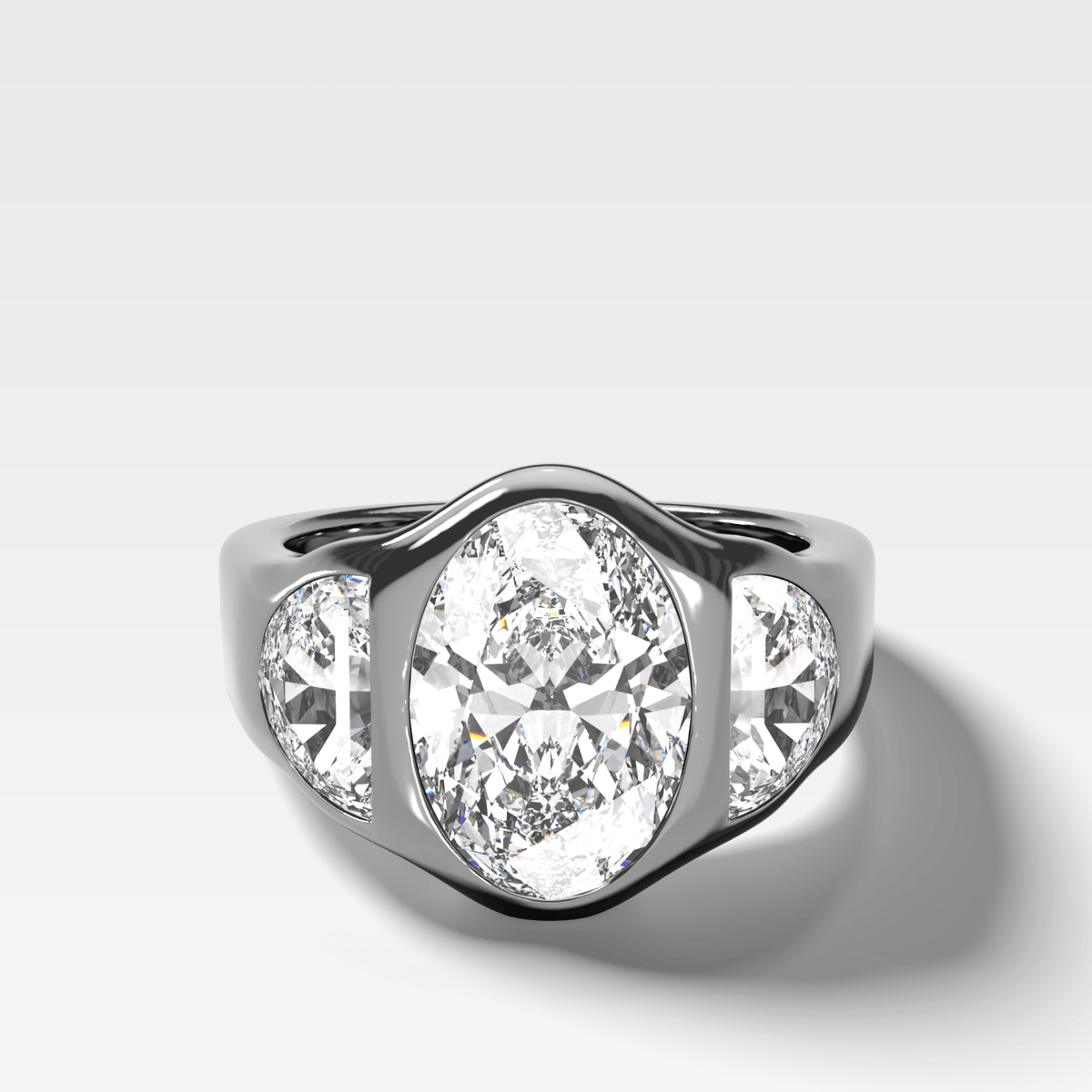 Burnished Three Stone Engagement Ring with Half Moon Sides & Oval Cut Diamond - GOODSTONE