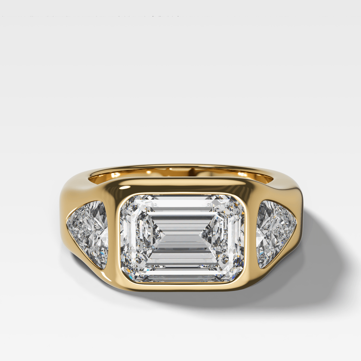 Burnished Three Stone Engagement Ring with Trilliant Sides and East West 2.53ct Lab Grown Emerald Cut Diamond - GOODSTONE