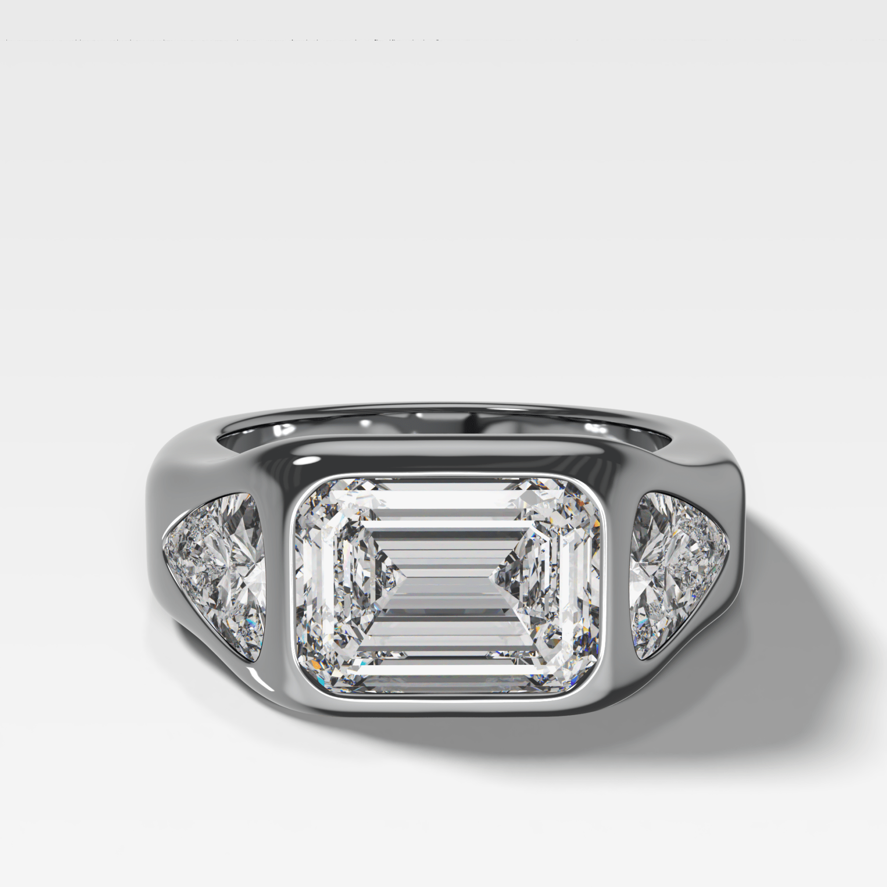Burnished Three Stone Engagement Ring with Trilliant Sides and East West Emerald Cut Diamond - GOODSTONE