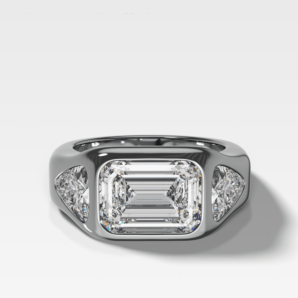 Burnished Three Stone Engagement Ring with Trilliant Sides and East West Emerald Cut Diamond - GOODSTONE