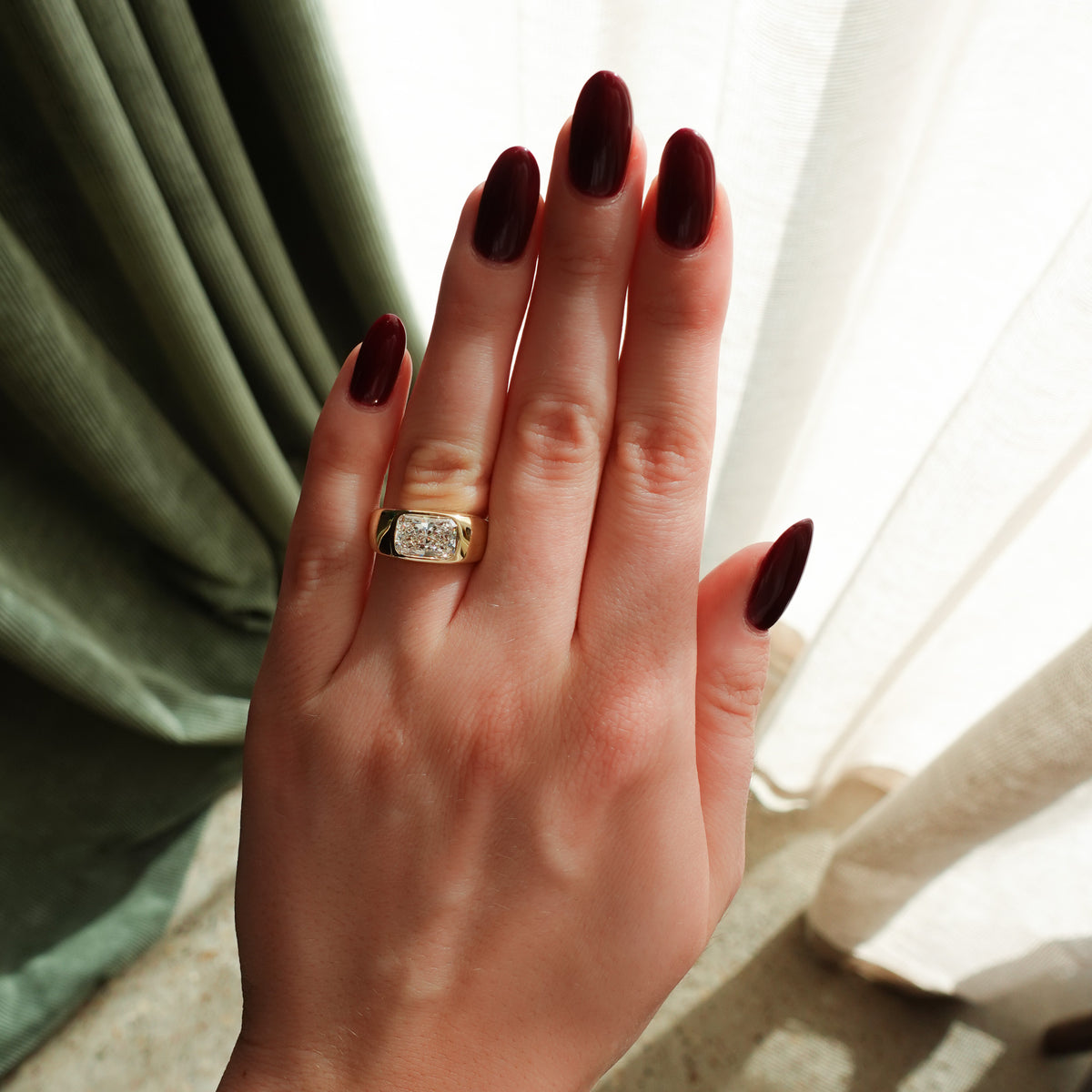 Burnished Solitaire Engagement Ring with Elongated Radiant Cut Diamond