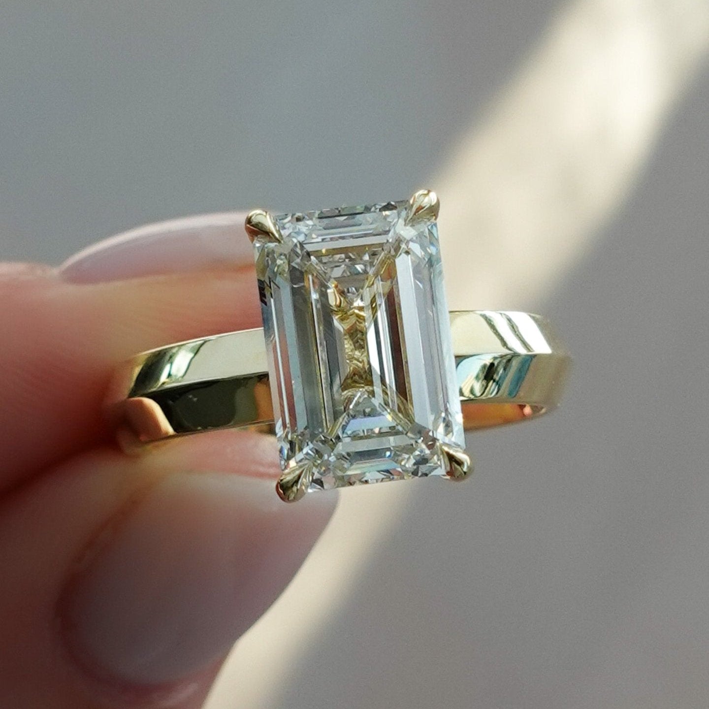 Butter Knife Solitaire Engagement Ring With Emerald Cut Diamond - GOODSTONE
