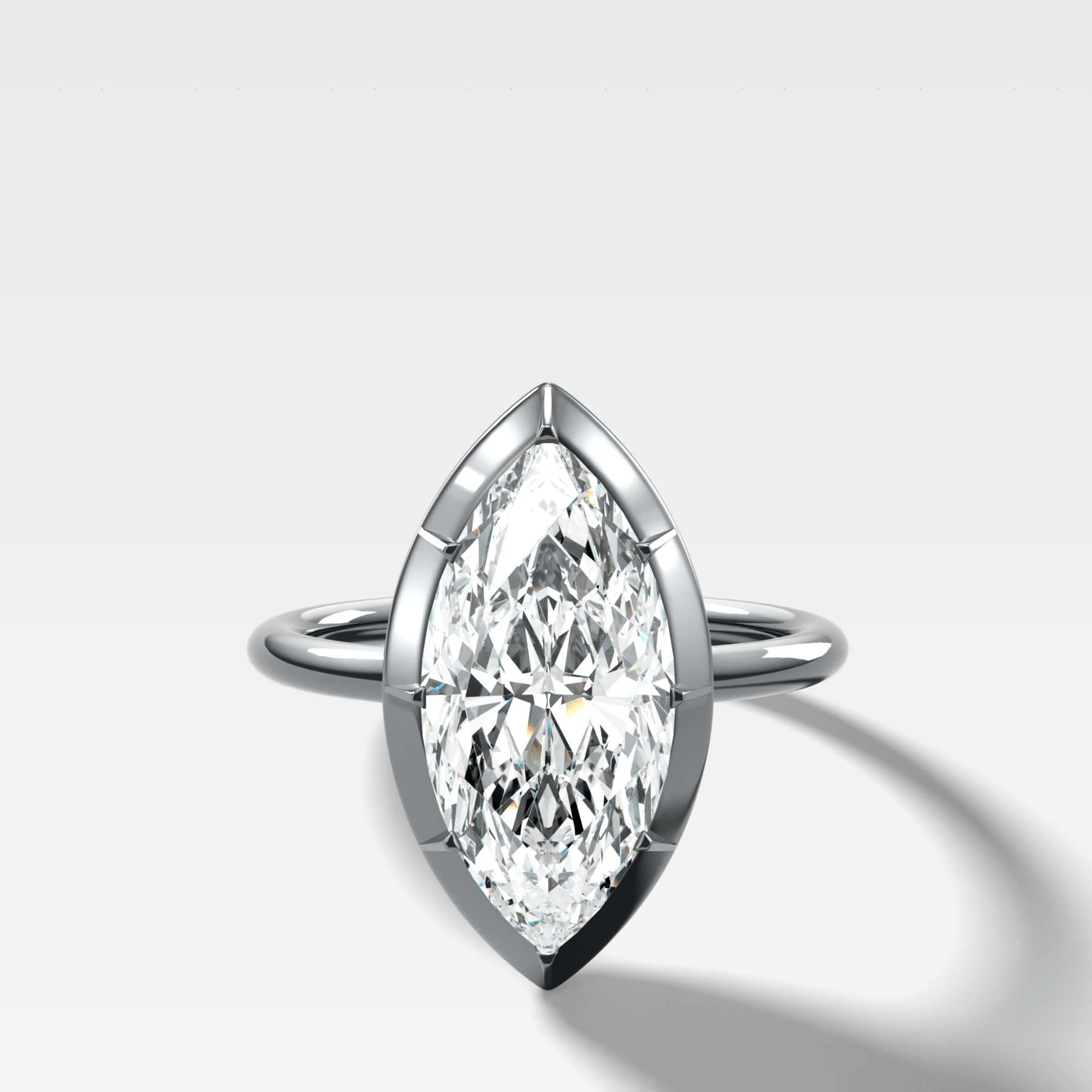 Button Back Solitaire Engagement Ring With a Marquise Cut Diamond - GOODSTONE