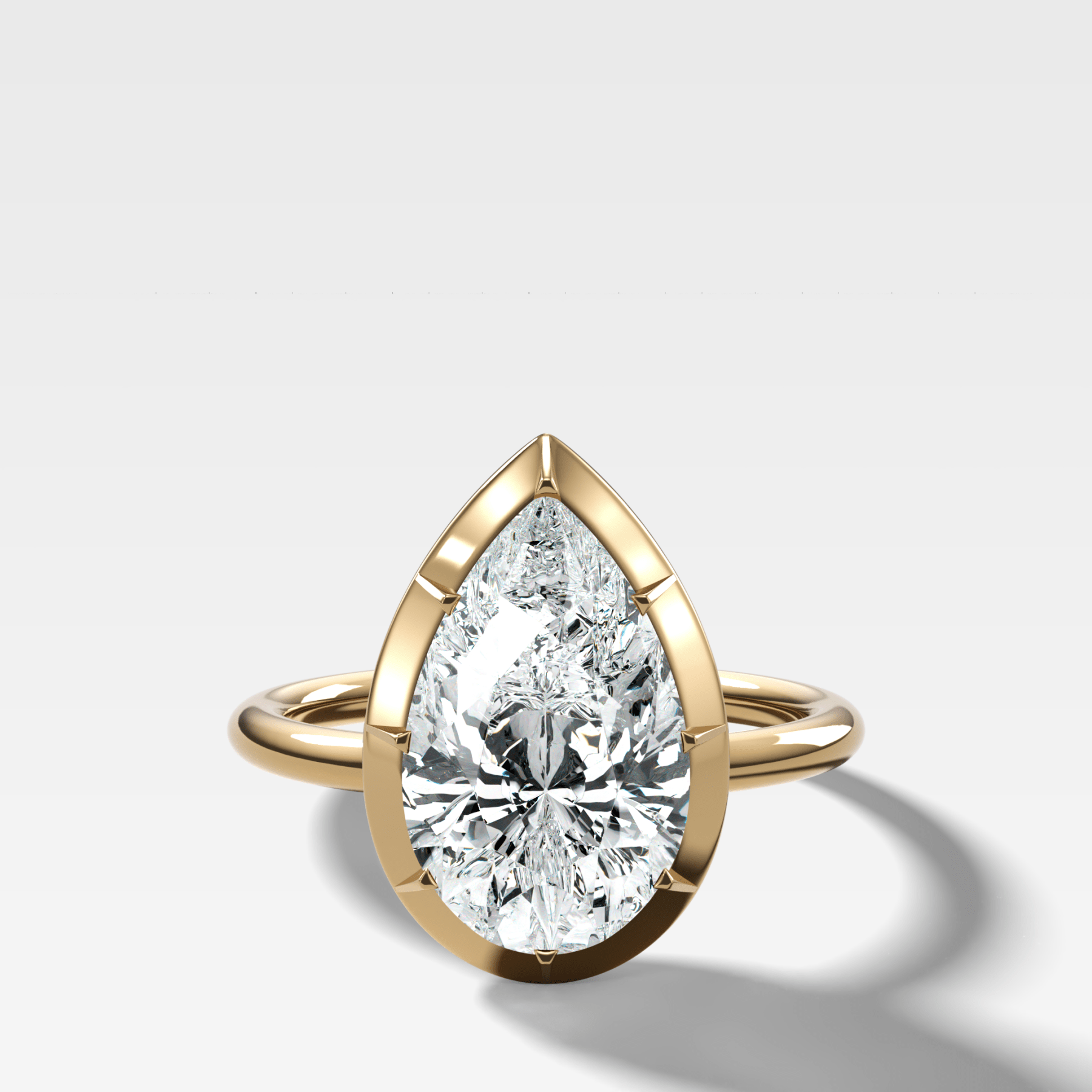 Button Back Solitaire Engagement Ring With a Pear Cut Diamond - GOODSTONE
