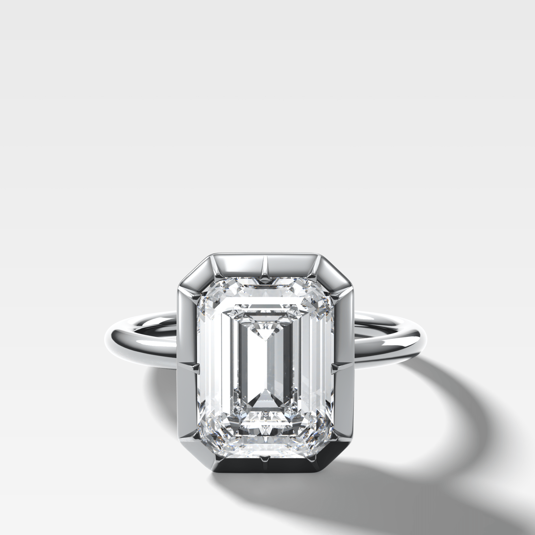 Button Back Solitaire Engagement Ring With an Emerald Cut Diamond - GOODSTONE