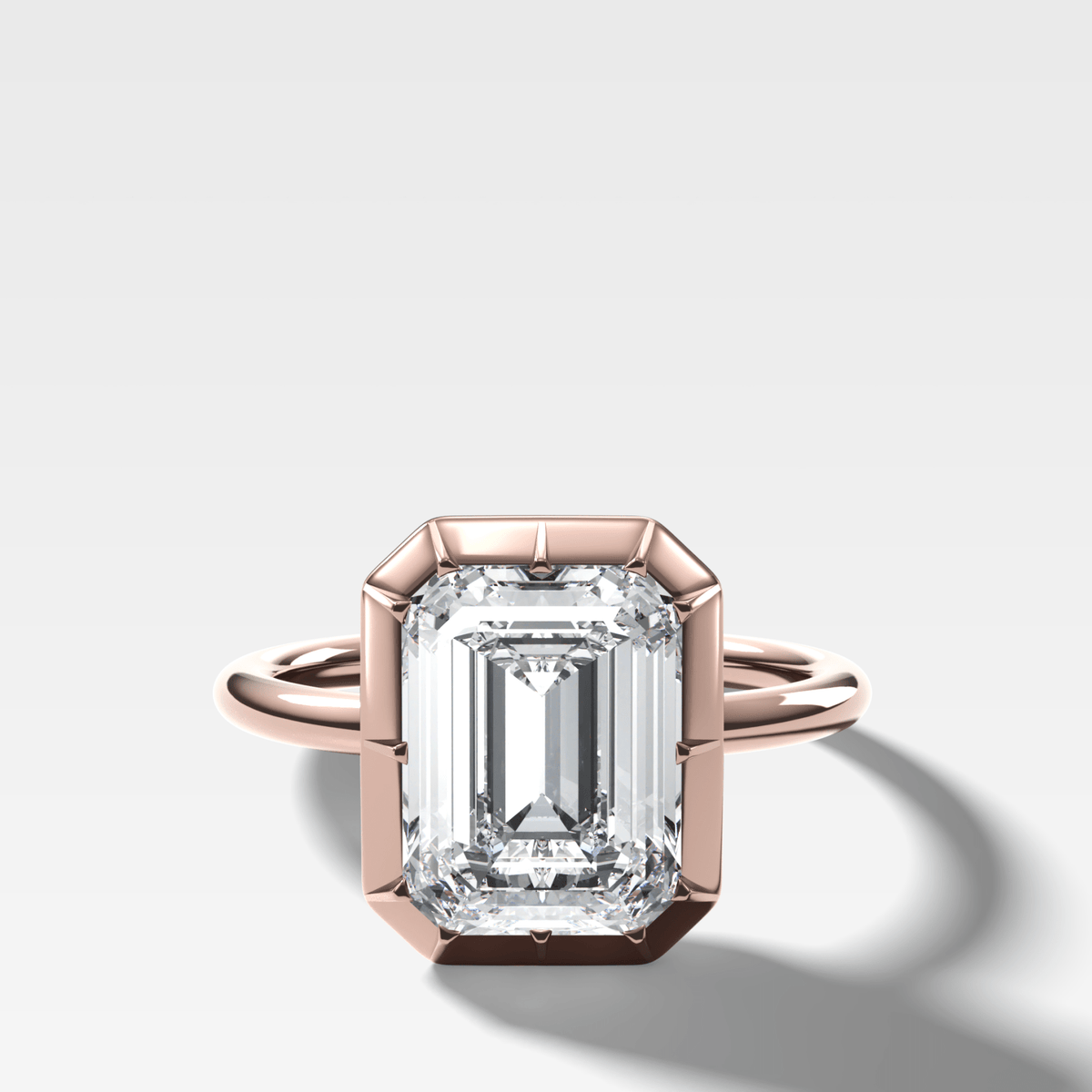 Button Back Solitaire Engagement Ring With an Emerald Cut Diamond - GOODSTONE