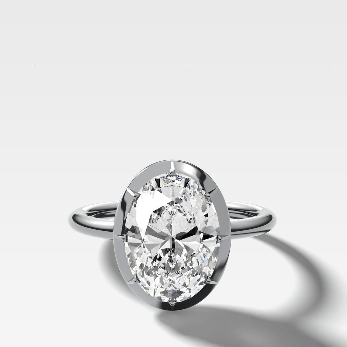 Button Back Solitaire Engagement Ring With an Oval Cut Diamond - GOODSTONE