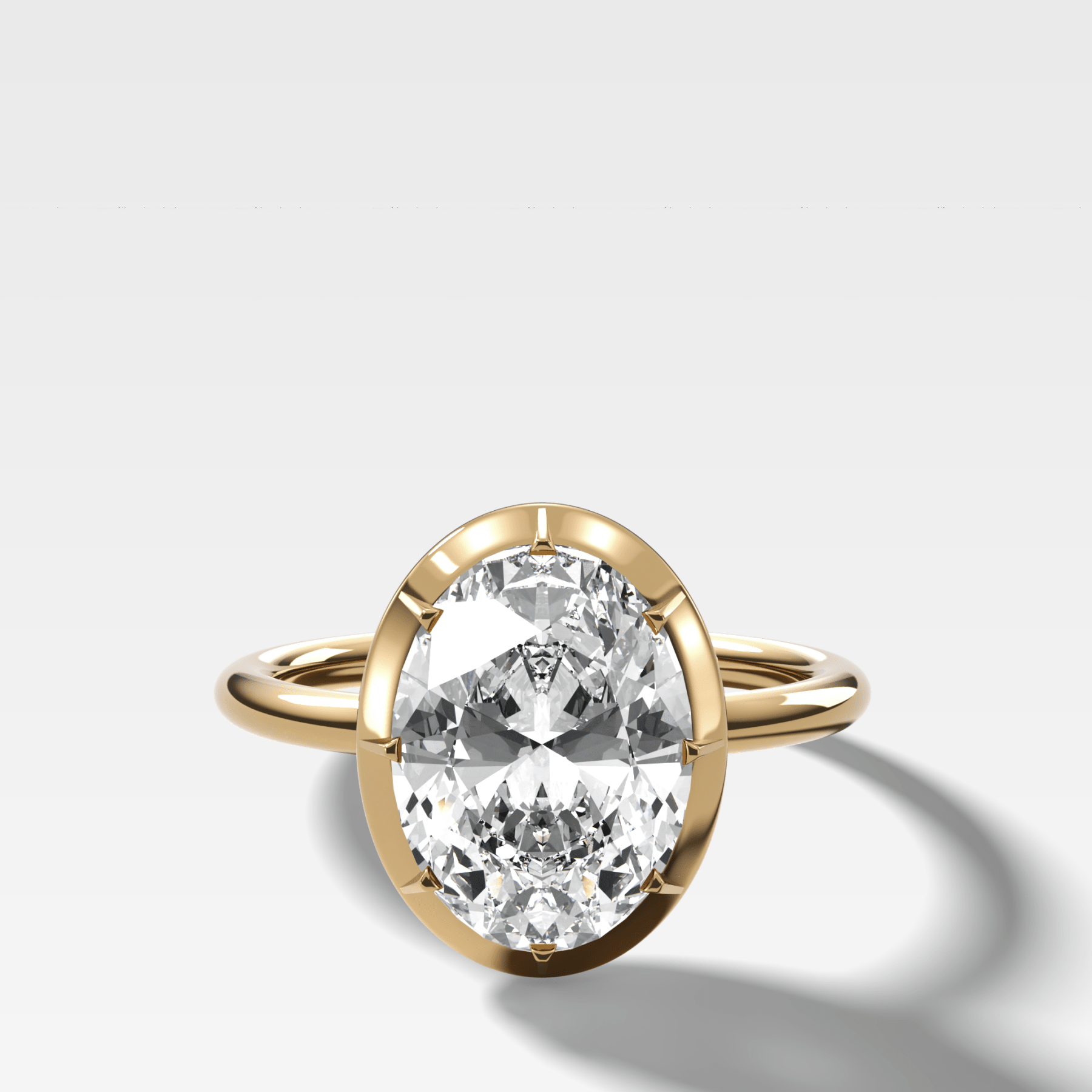 Button Back Solitaire Engagement Ring With an Oval Cut Diamond - GOODSTONE