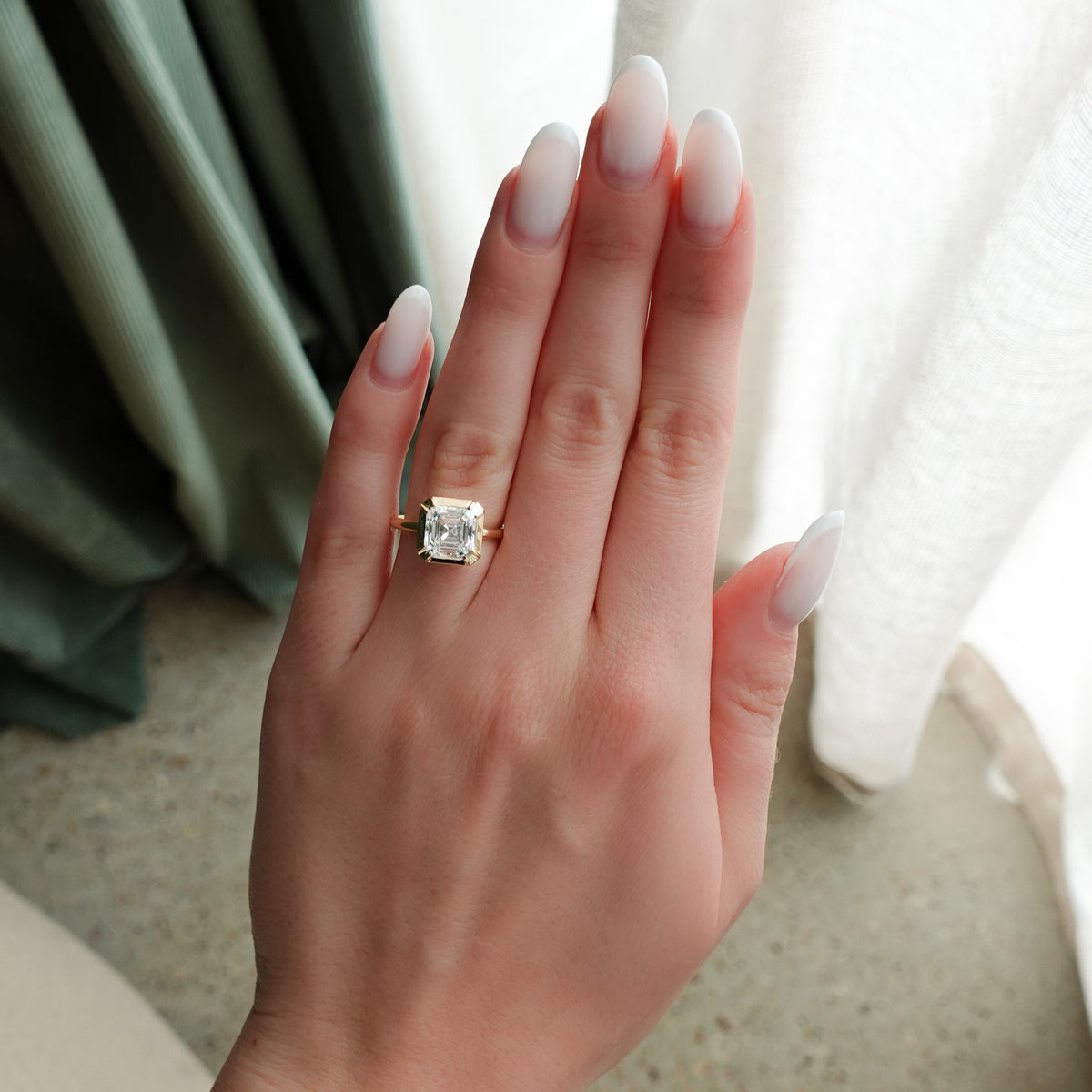 Button Back Solitaire Engagement Ring With an Asscher Cut Diamond