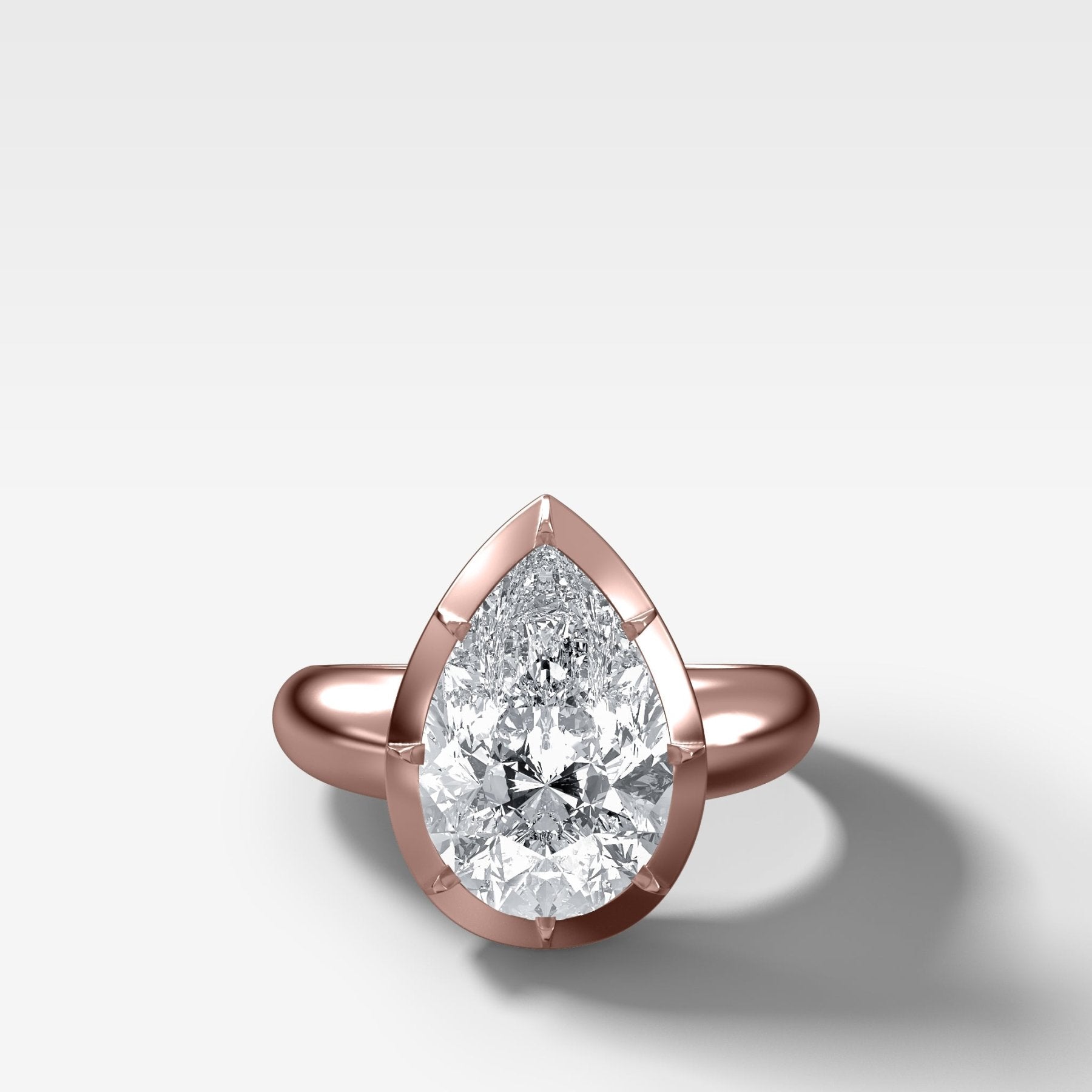 Club Button Back Solitaire with a Pear Cut Diamond - GOODSTONE