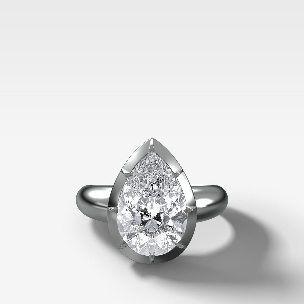Club Button Back Solitaire with a Pear Cut Diamond - GOODSTONE