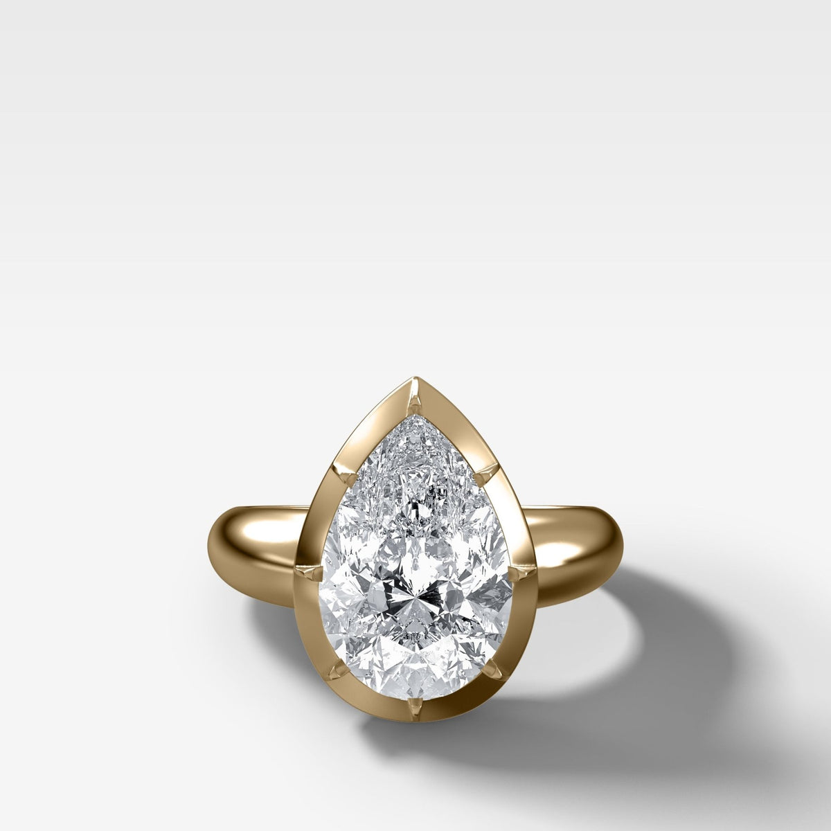 Club Button Back Solitaire with a Pear Cut Diamond - GOODSTONE