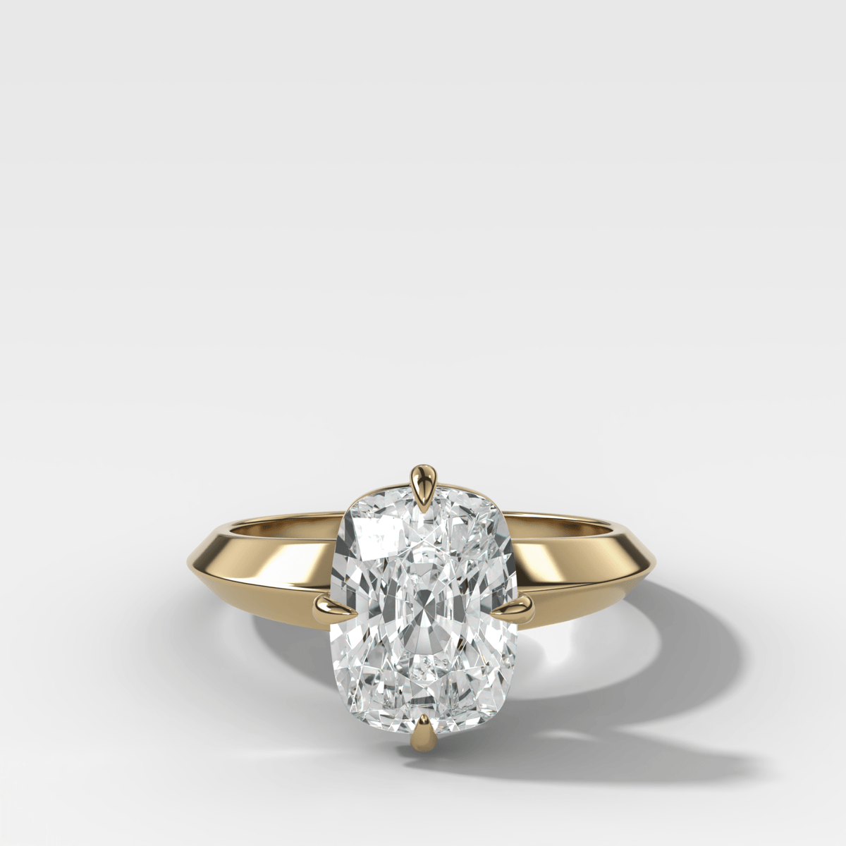 Compass Tapered Butter Knife Finest Solitaire Engagement Ring With a Cushion Cut Diamond - GOODSTONE