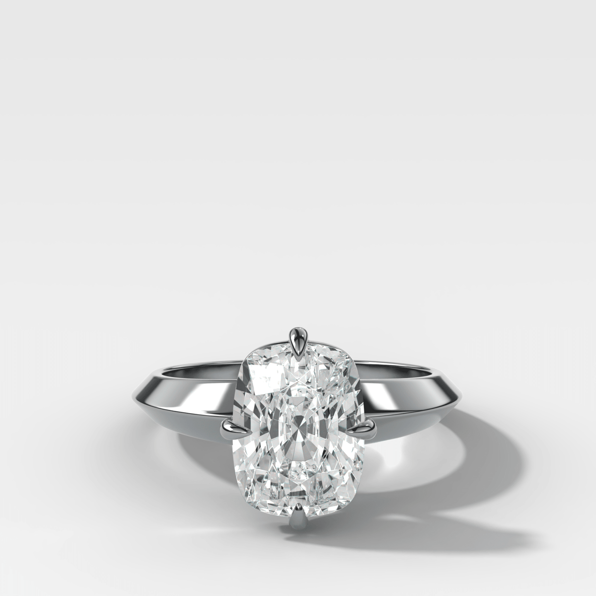 Compass Tapered Butter Knife Finest Solitaire Engagement Ring With a Cushion Cut Diamond - GOODSTONE
