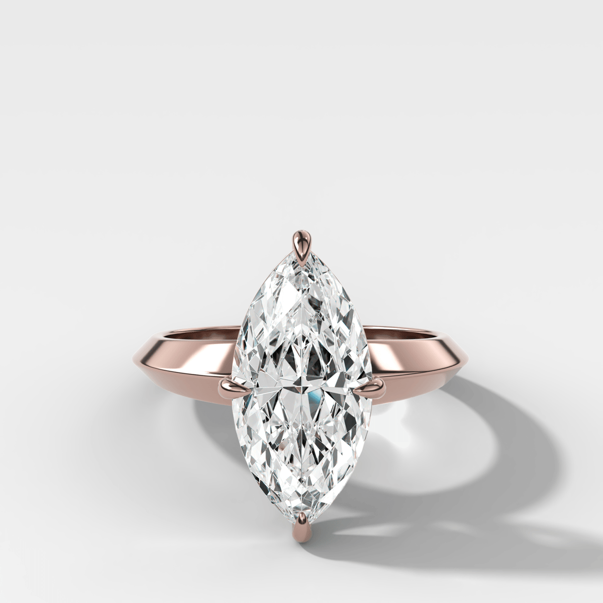Compass Tapered Butter Knife Finest Solitaire Engagement Ring With a Marquise Cut Diamond - GOODSTONE