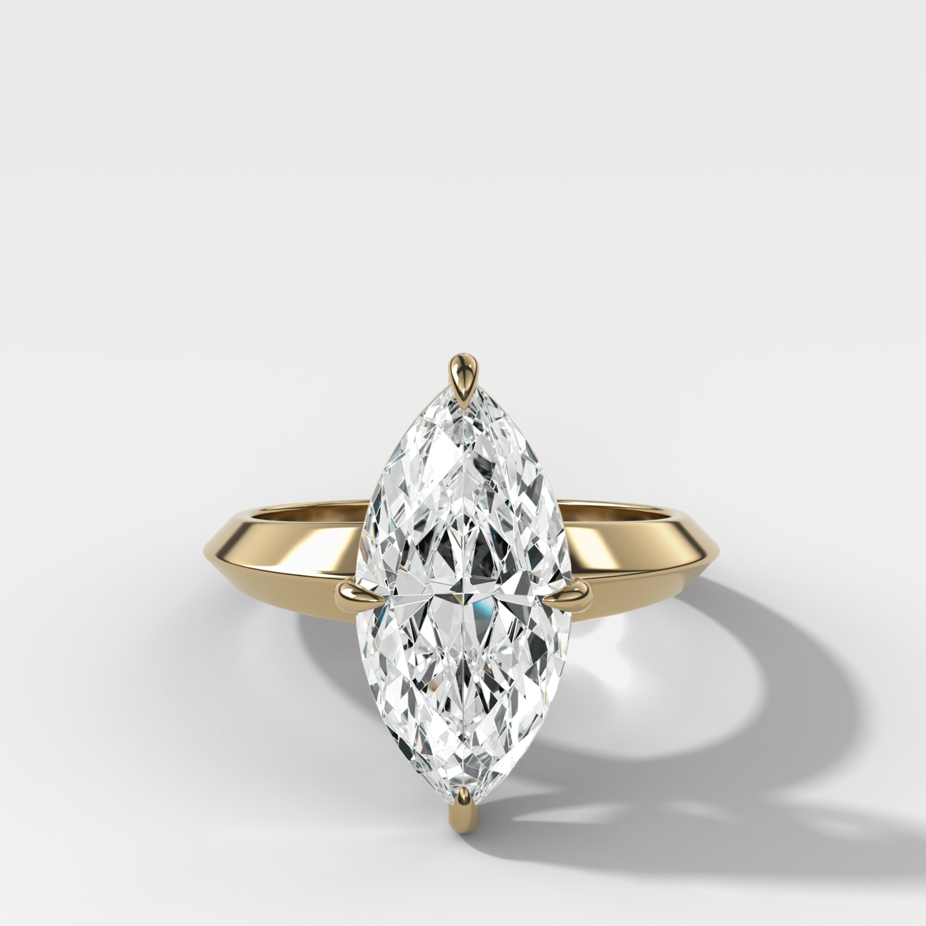 Compass Tapered Butter Knife Finest Solitaire Engagement Ring With a Marquise Cut Diamond - GOODSTONE