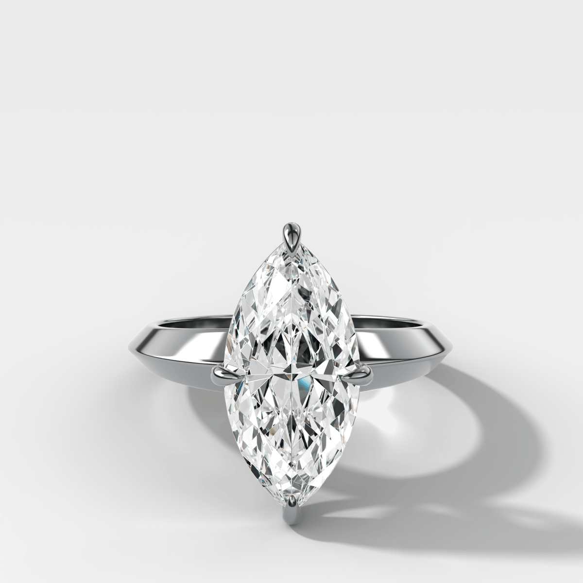 Compass Tapered Butter Knife Finest Solitaire Engagement Ring With a Marquise Cut Diamond - GOODSTONE