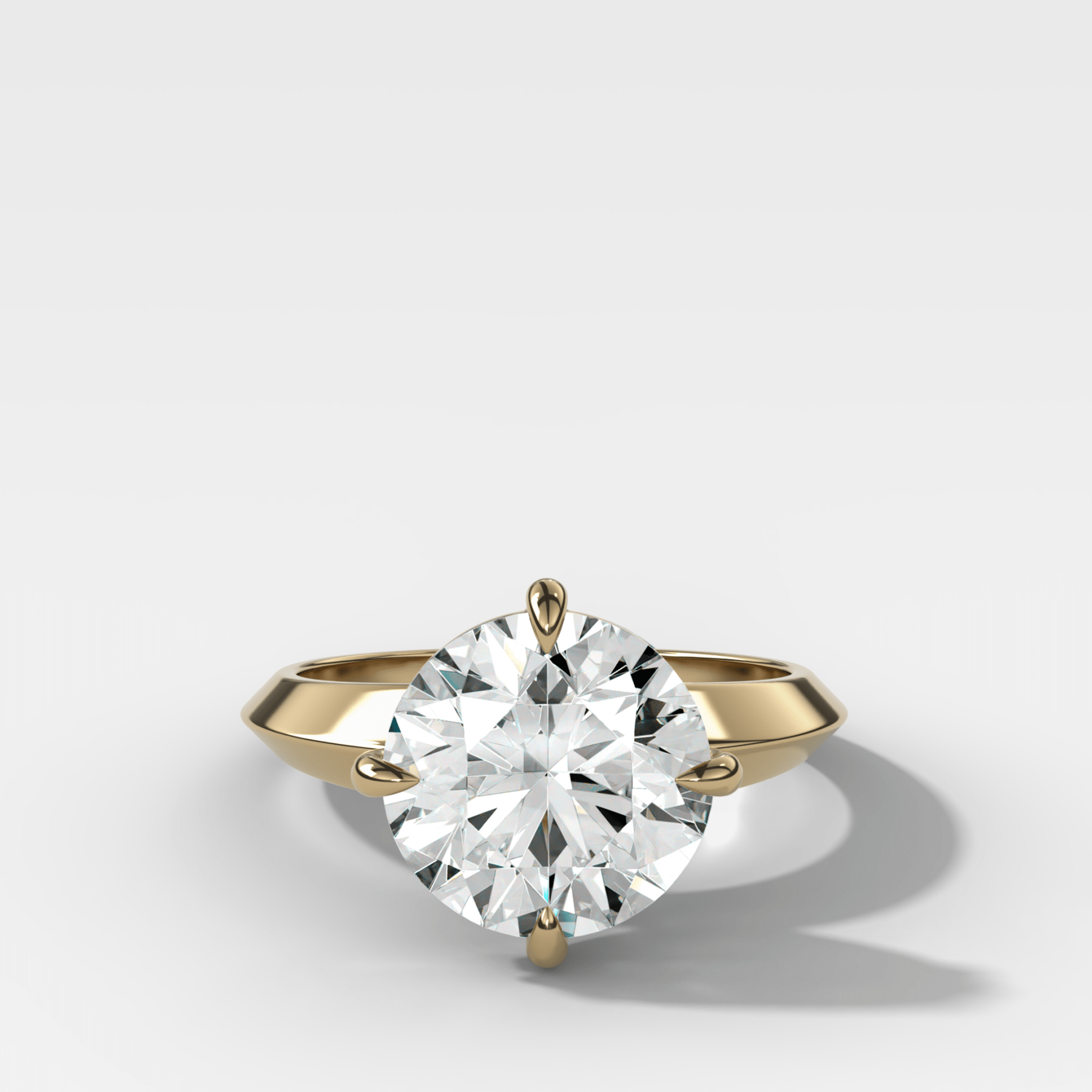 Compass Tapered Butter Knife Finest Solitaire Engagement Ring With a Round Cut Diamond - GOODSTONE