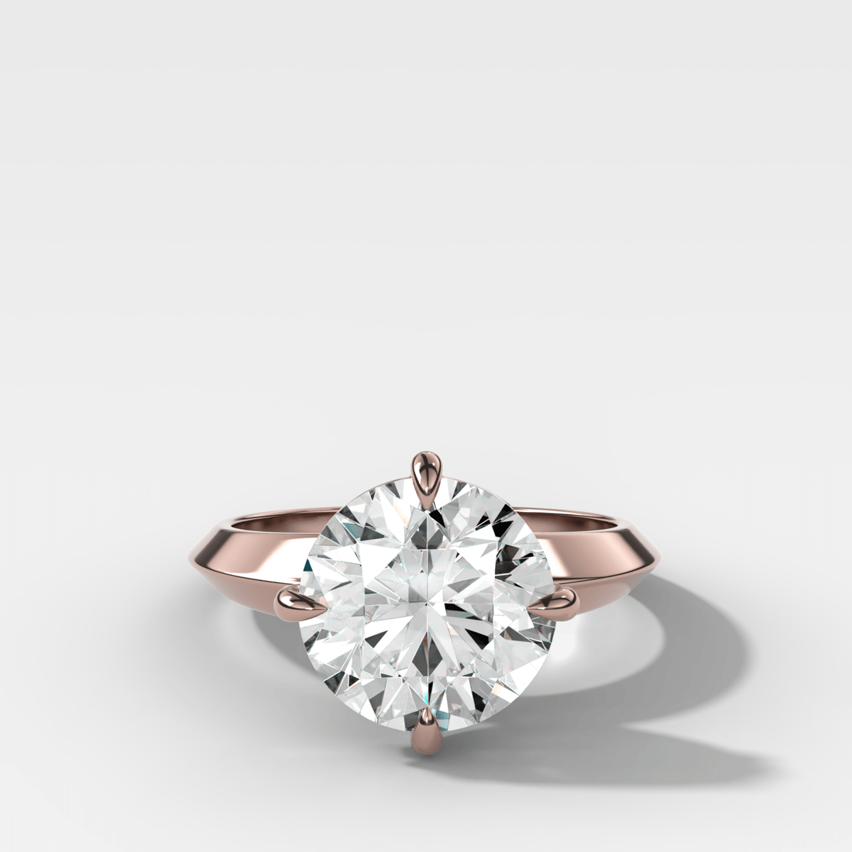 Compass Tapered Butter Knife Finest Solitaire Engagement Ring With a Round Cut Diamond - GOODSTONE