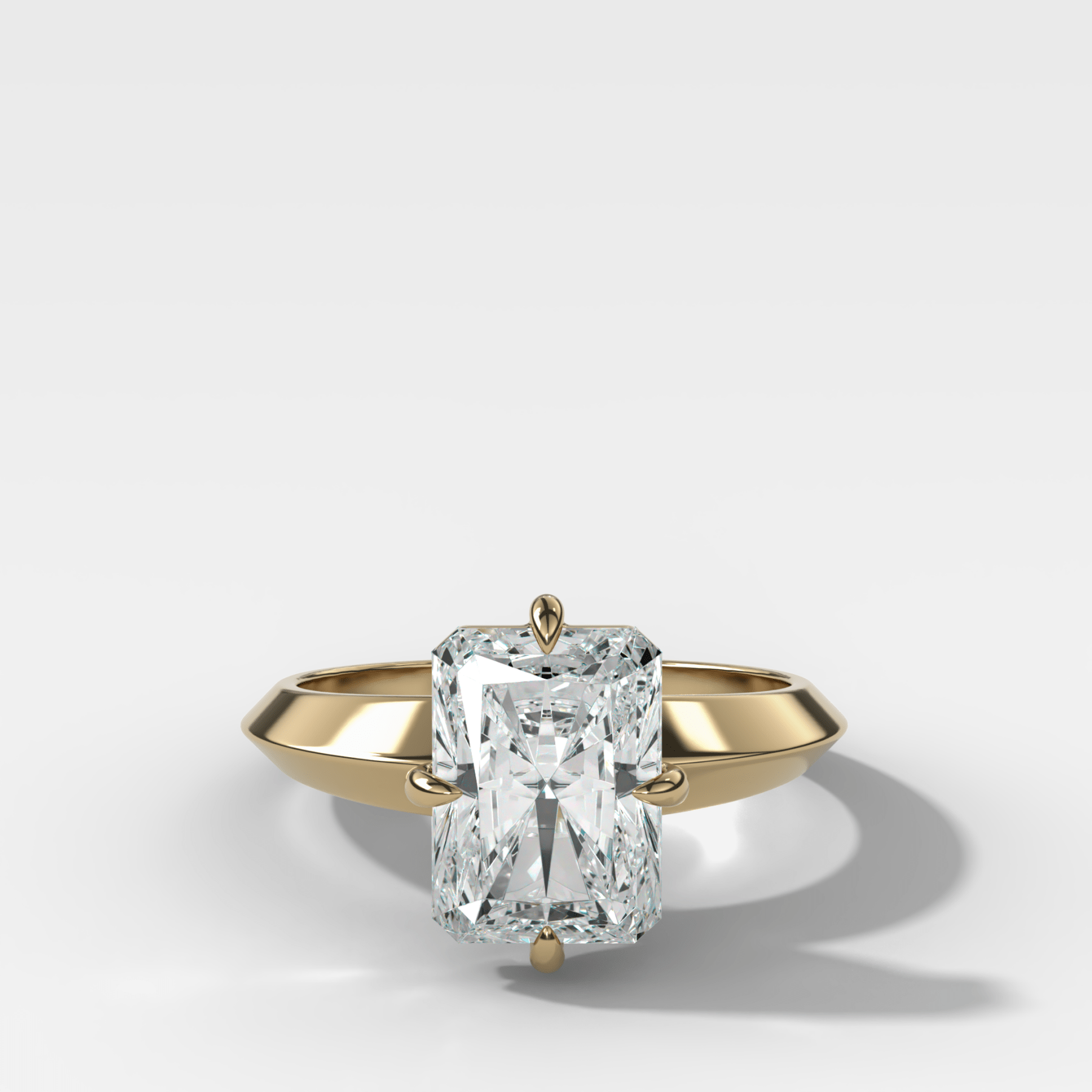 Compass Tapered Butter Knife Finest Solitaire Engagement Ring With an Elongated Radiant Cut Diamond - GOODSTONE