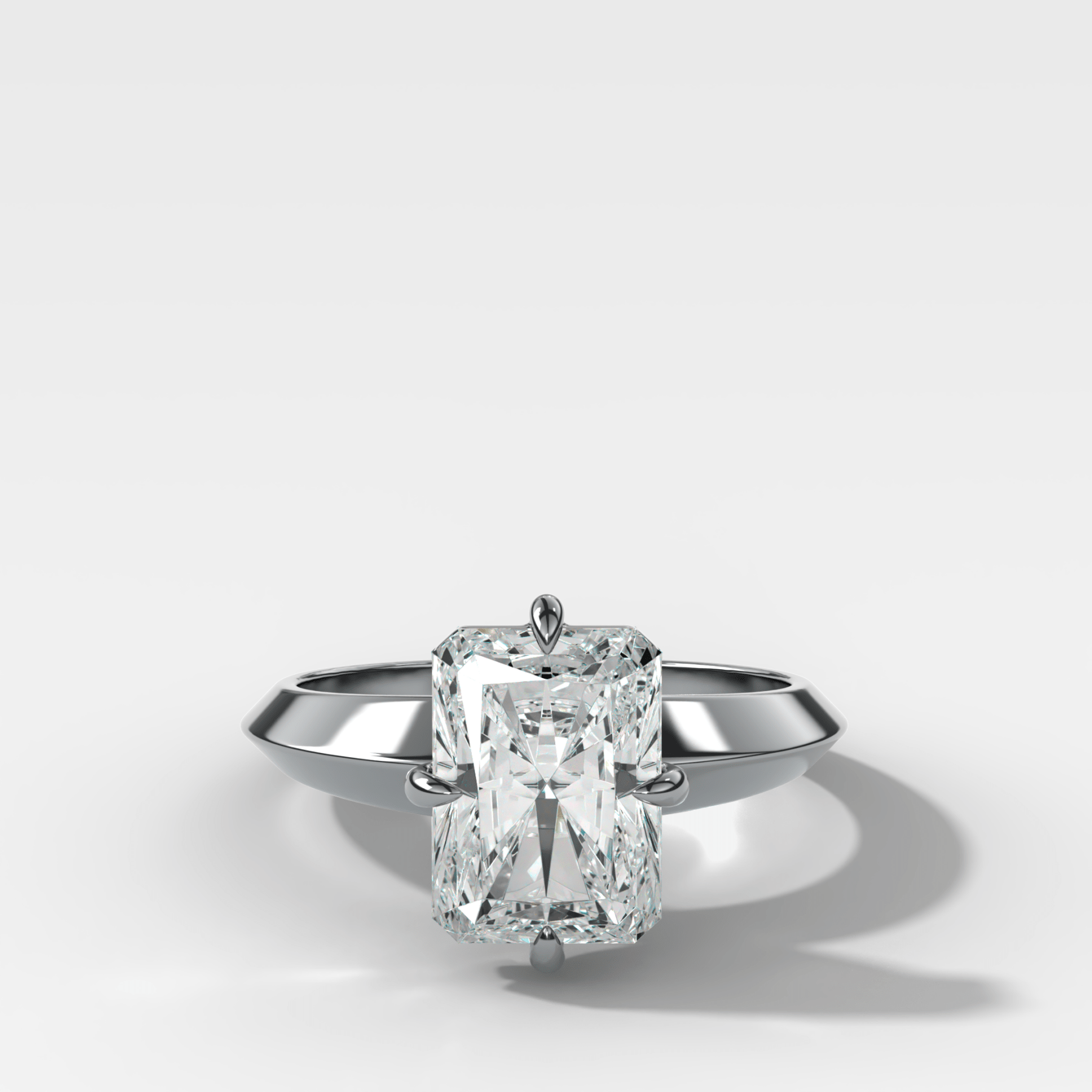 Compass Tapered Butter Knife Finest Solitaire Engagement Ring With an Elongated Radiant Cut Diamond - GOODSTONE