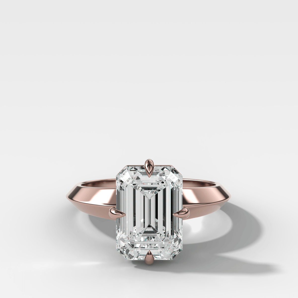 Compass Tapered Butter Knife Finest Solitaire Engagement Ring With an Emerald Cut Diamond - GOODSTONE
