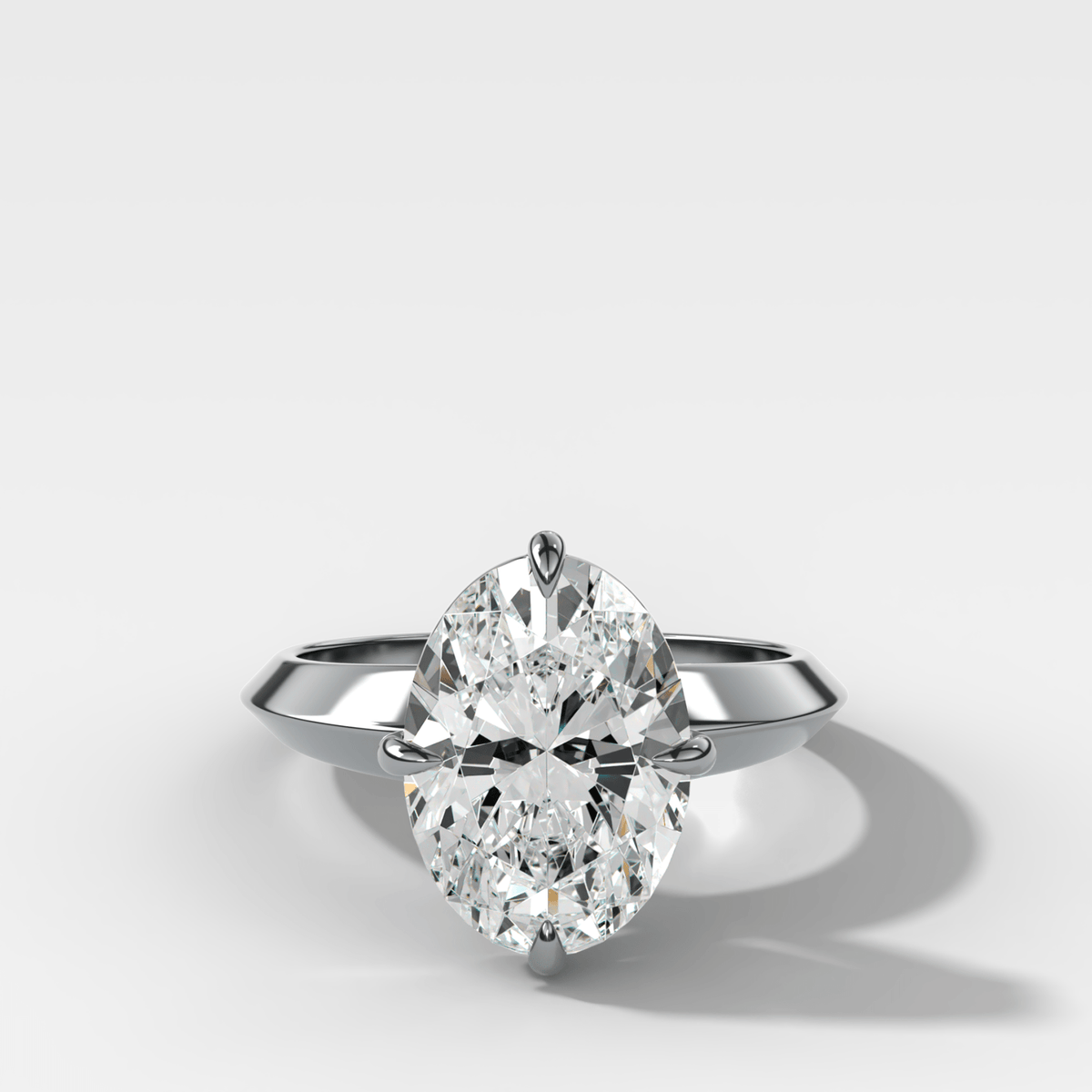 Compass Tapered Butter Knife Finest Solitaire Engagement Ring With an Oval Cut Diamond - GOODSTONE