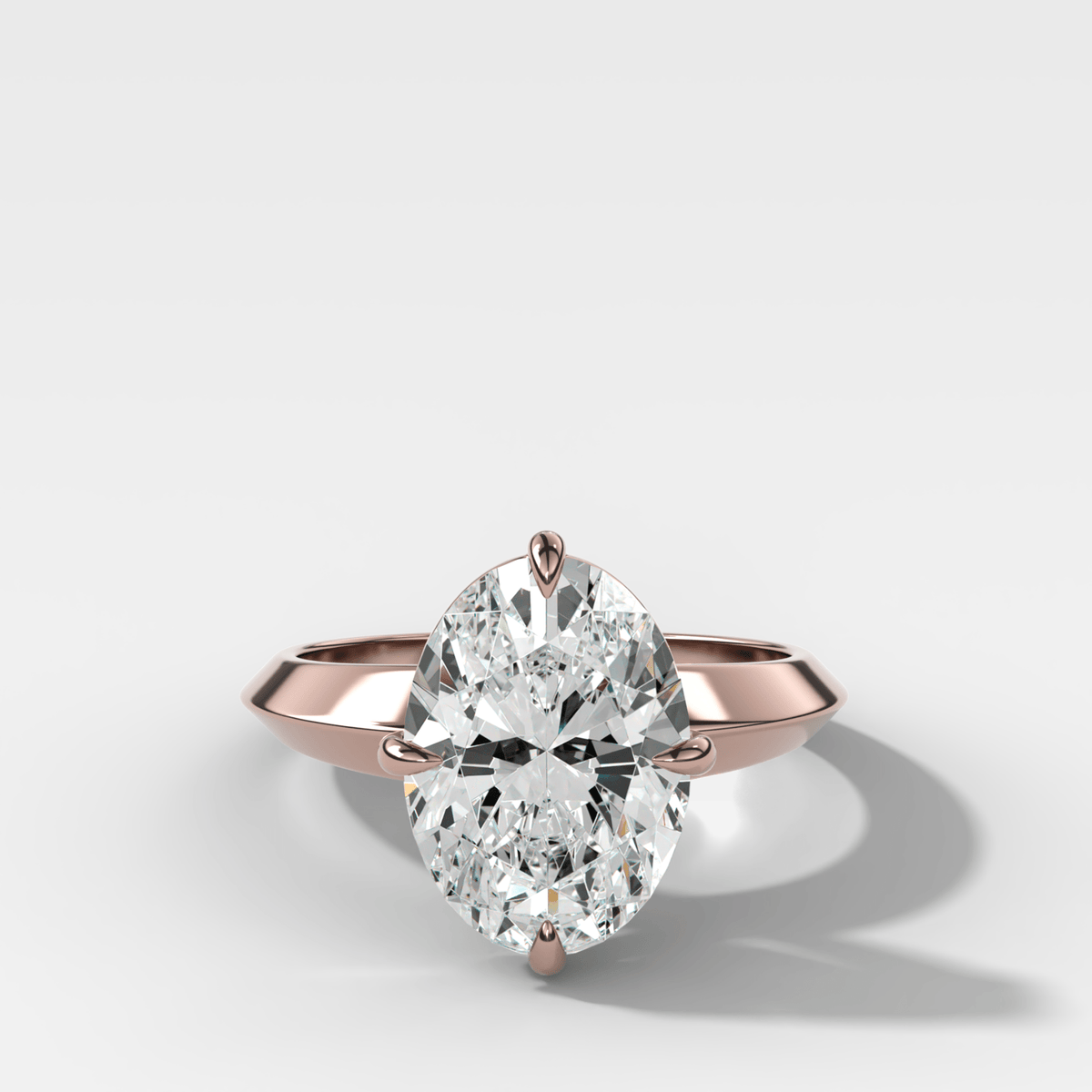 Compass Tapered Butter Knife Finest Solitaire Engagement Ring With an Oval Cut Diamond - GOODSTONE