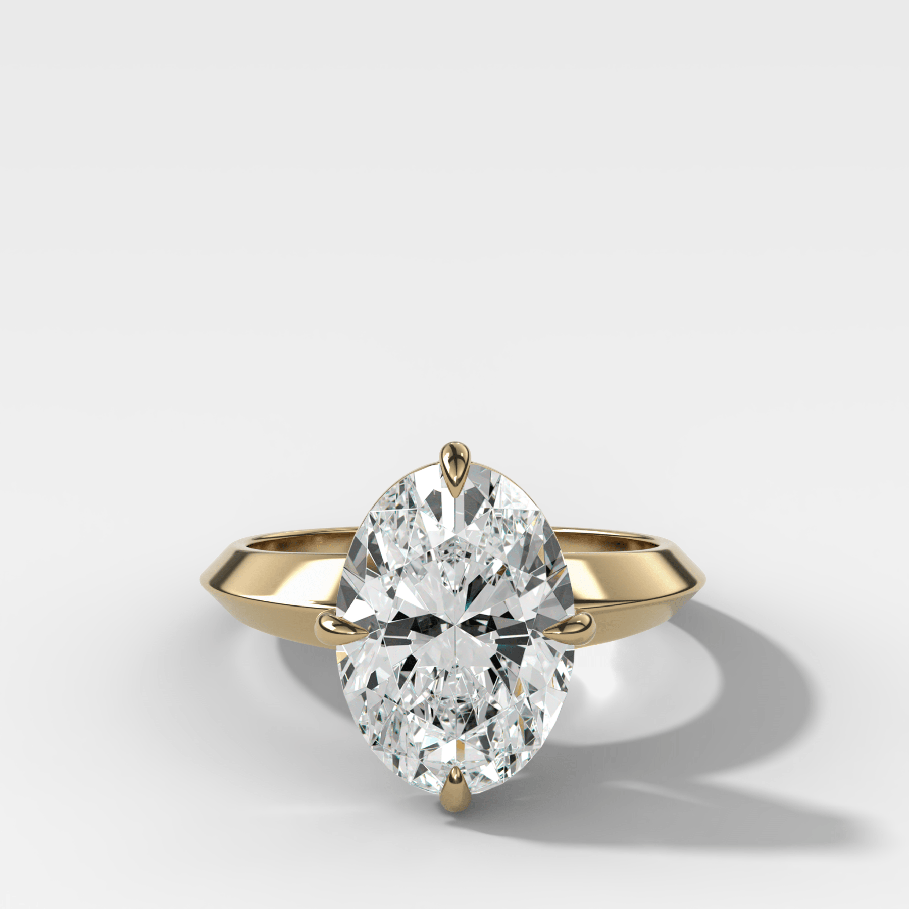 Compass Tapered Butter Knife Finest Solitaire Engagement Ring With an Oval Cut Diamond - GOODSTONE