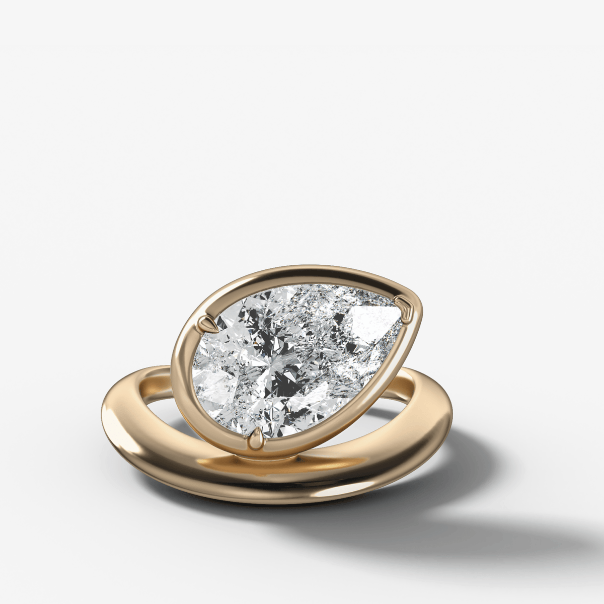 Contoured Club Engagement Ring with a Pear Cut Diamond - GOODSTONE