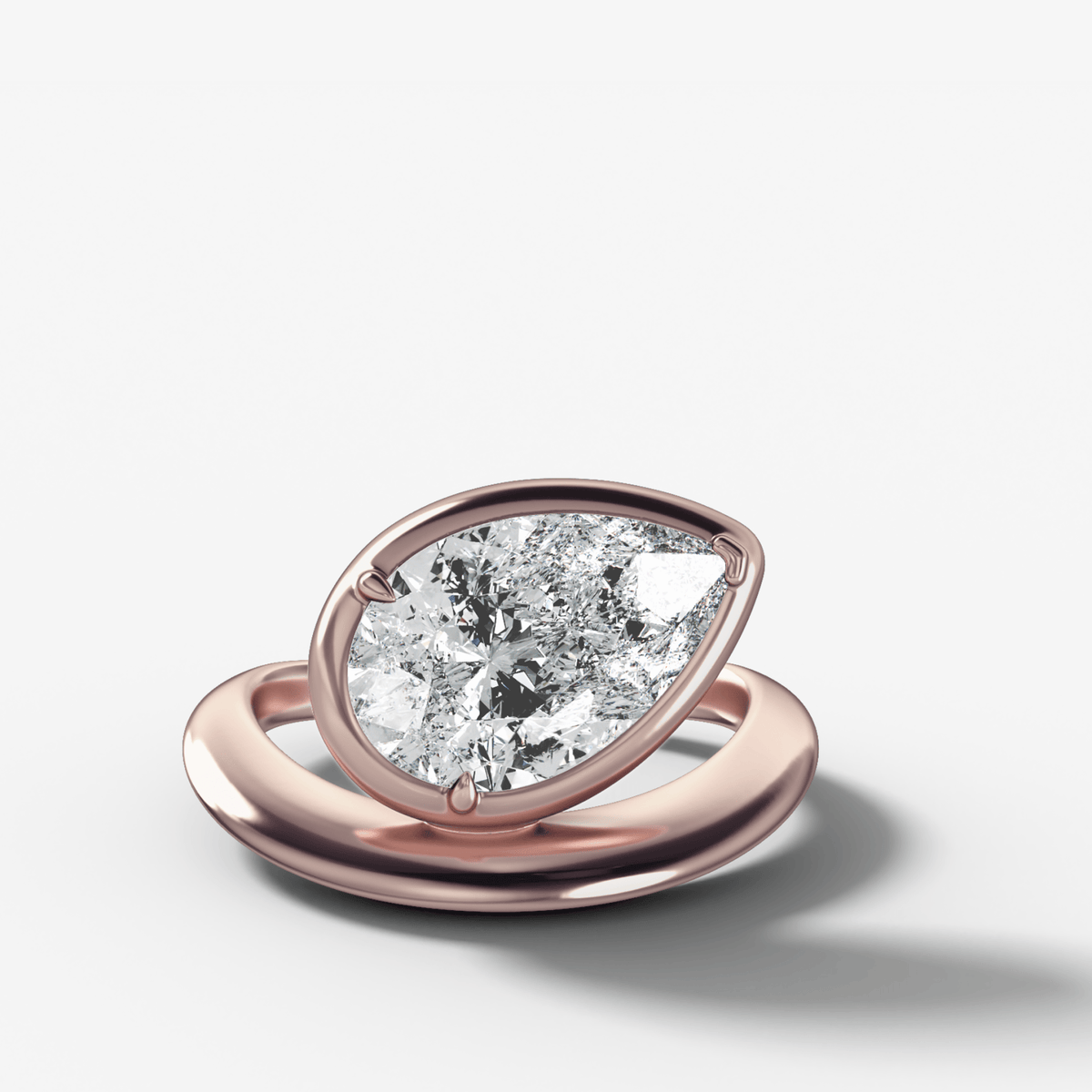 Contoured Club Engagement Ring with a Pear Cut Diamond - GOODSTONE