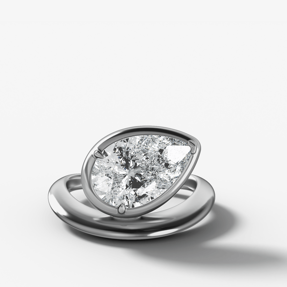 Contoured Club Engagement Ring with a Pear Cut Diamond - GOODSTONE