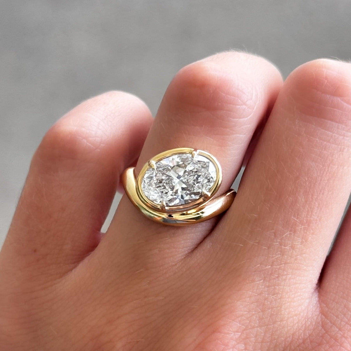Contoured Club Engagement Ring with an Oval Cut Diamond - GOODSTONE
