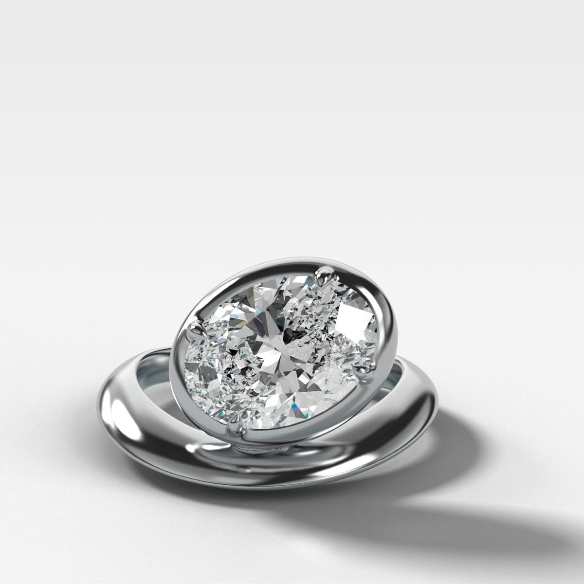 Contoured Club Engagement Ring with an Oval Cut Diamond - GOODSTONE