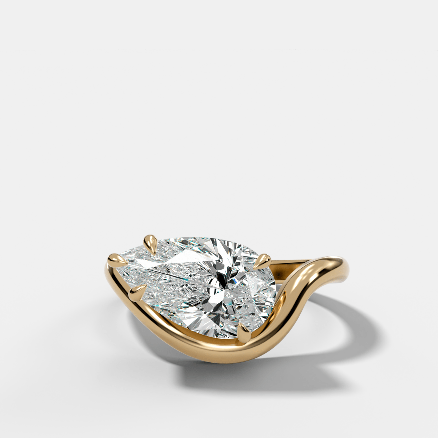Contoured Engagement Ring with a Pear Cut Diamond - GOODSTONE