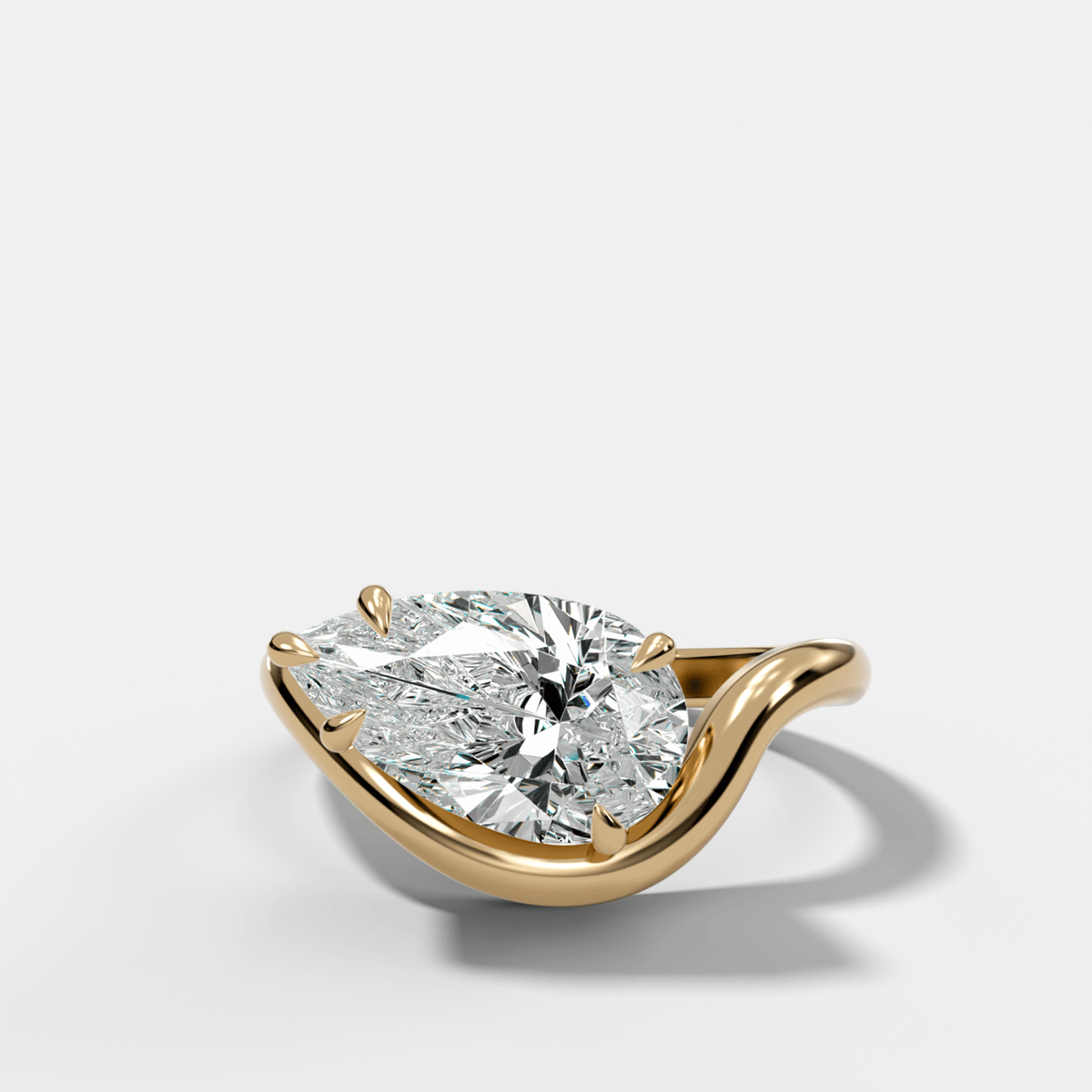 Contoured Engagement Ring with a Pear Cut Diamond - GOODSTONE