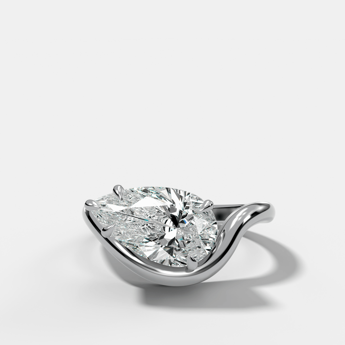 Contoured Engagement Ring with a Pear Cut Diamond - GOODSTONE