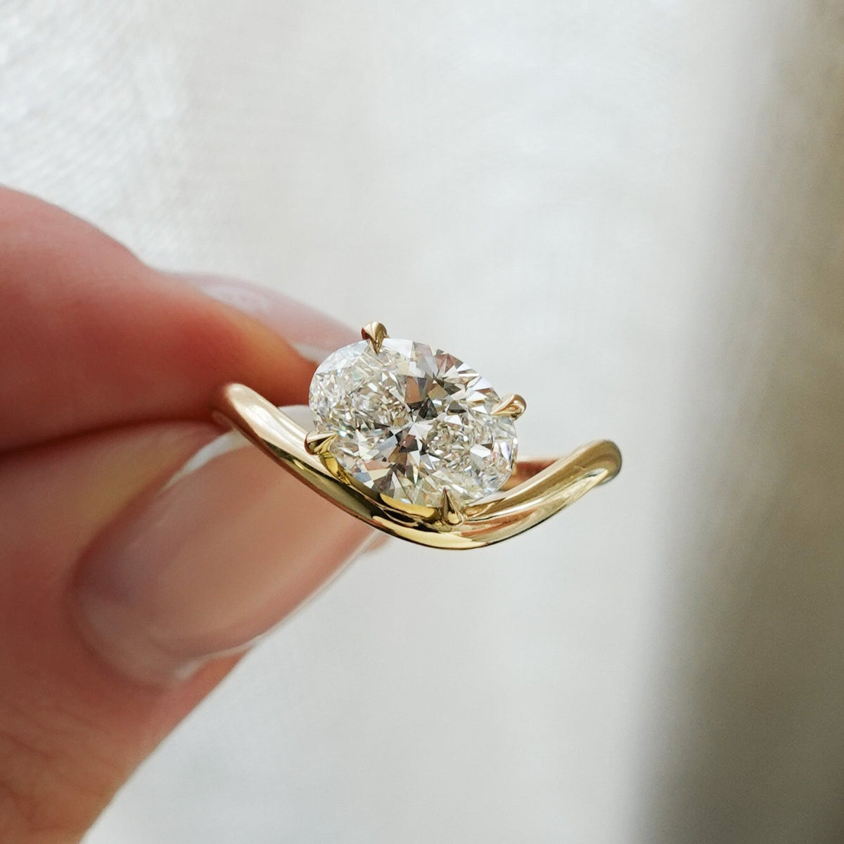 Contoured Engagement Ring with an Oval Cut Diamond - GOODSTONE