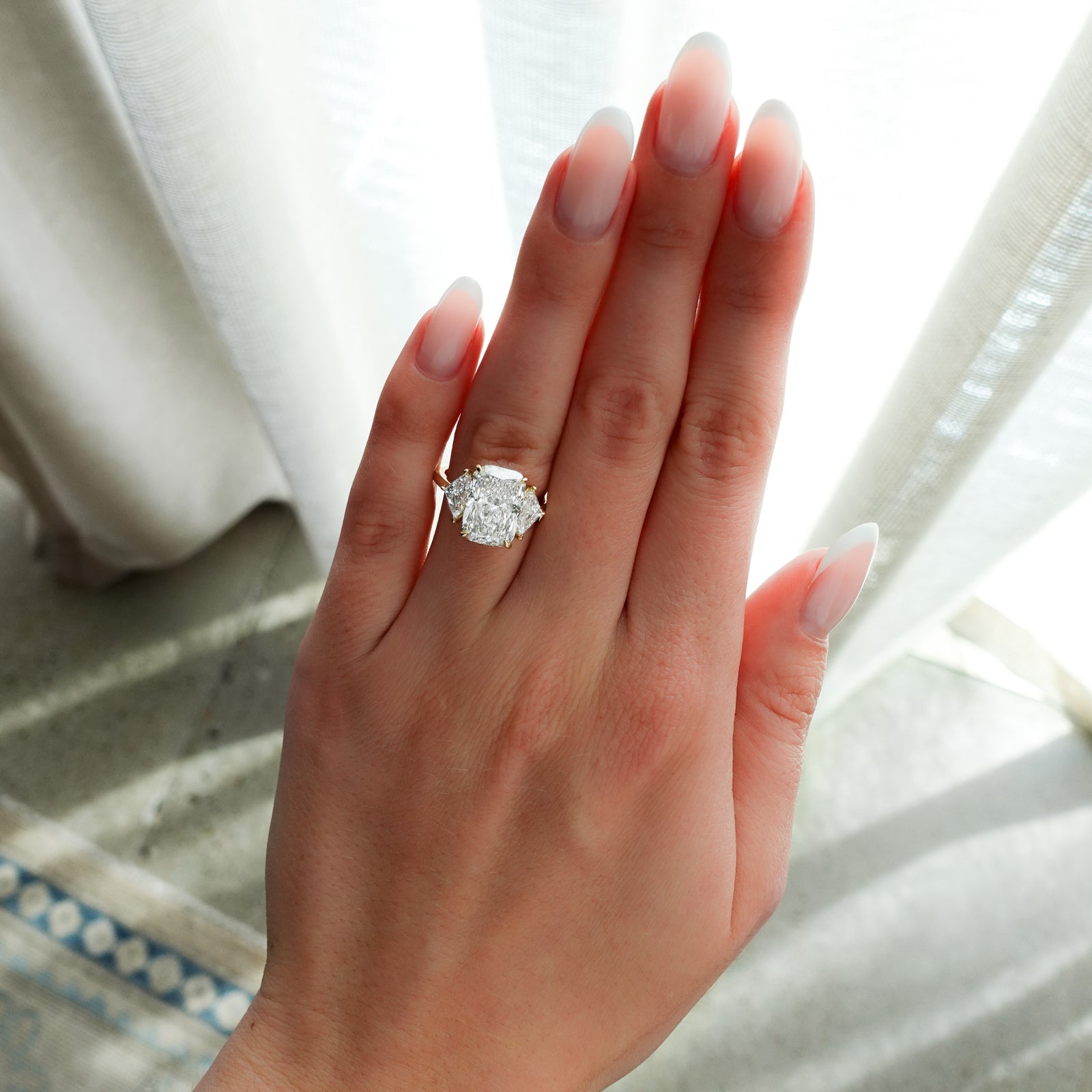 Three Stone ring with Shield Side Stones and an Elongated Cushion cut Engagement Good Stone Inc 