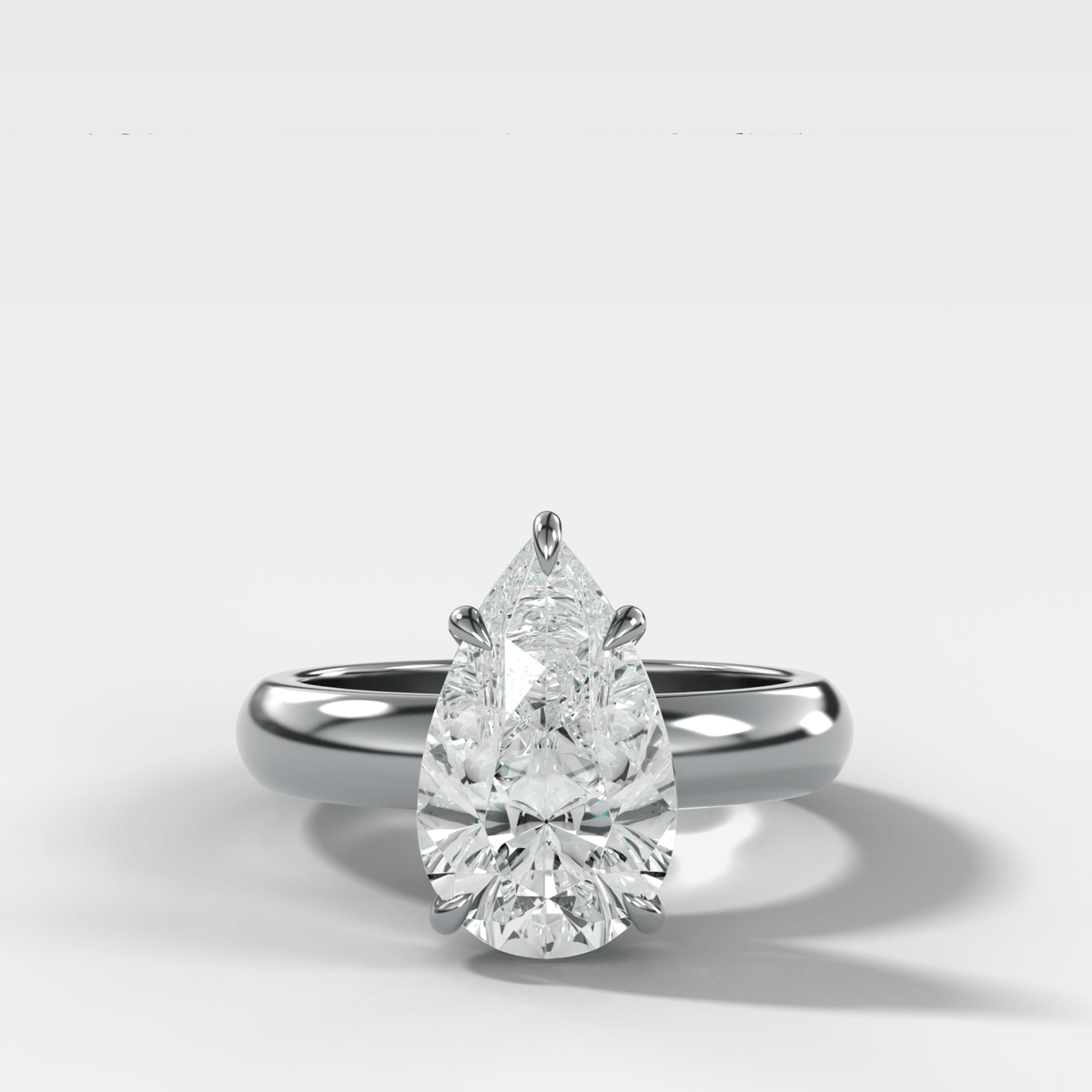Domed Solitaire Engagement Ring with a Pear Cut Diamond - GOODSTONE