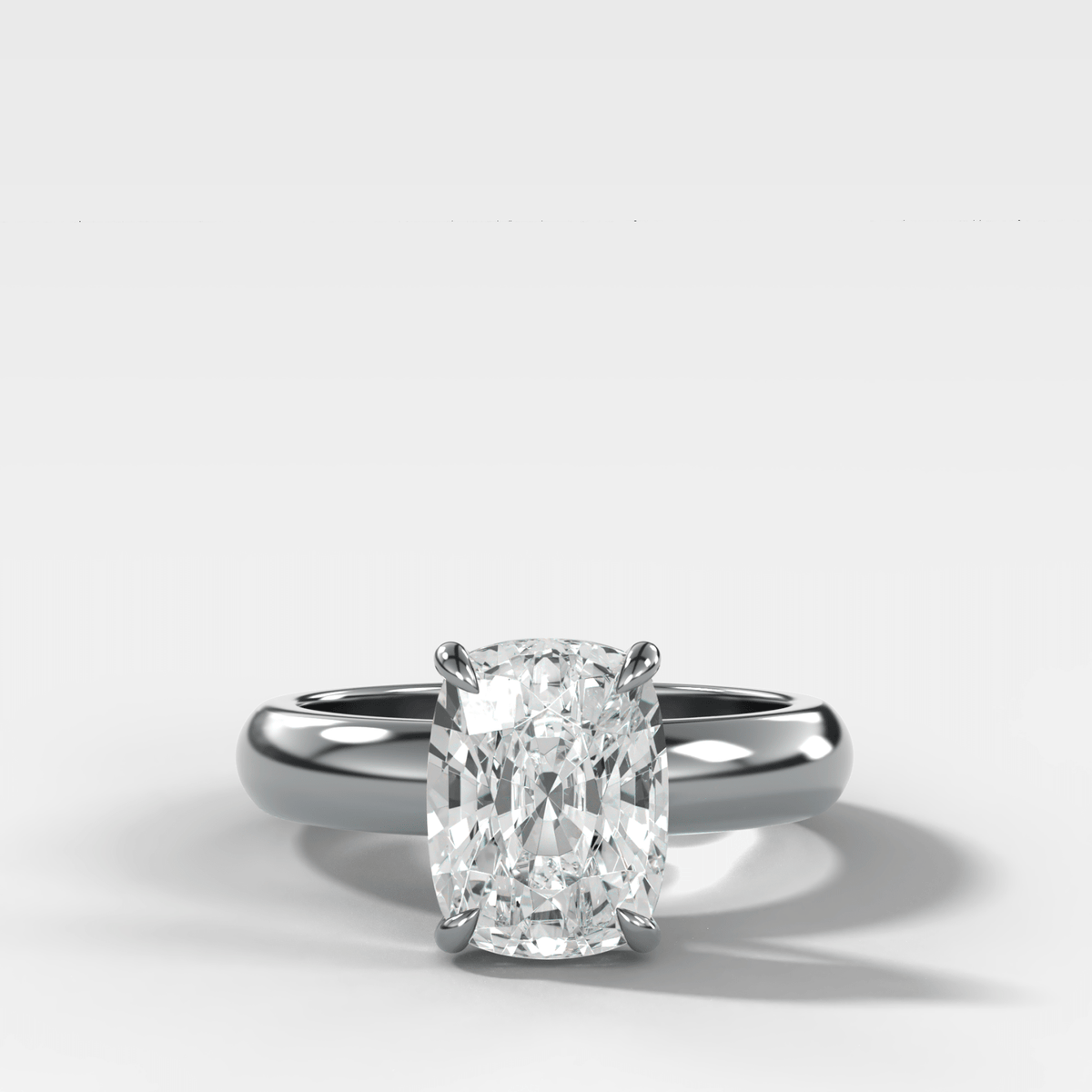 Domed Solitaire Engagement Ring with an Elongated Cushion Cut Diamond - GOODSTONE