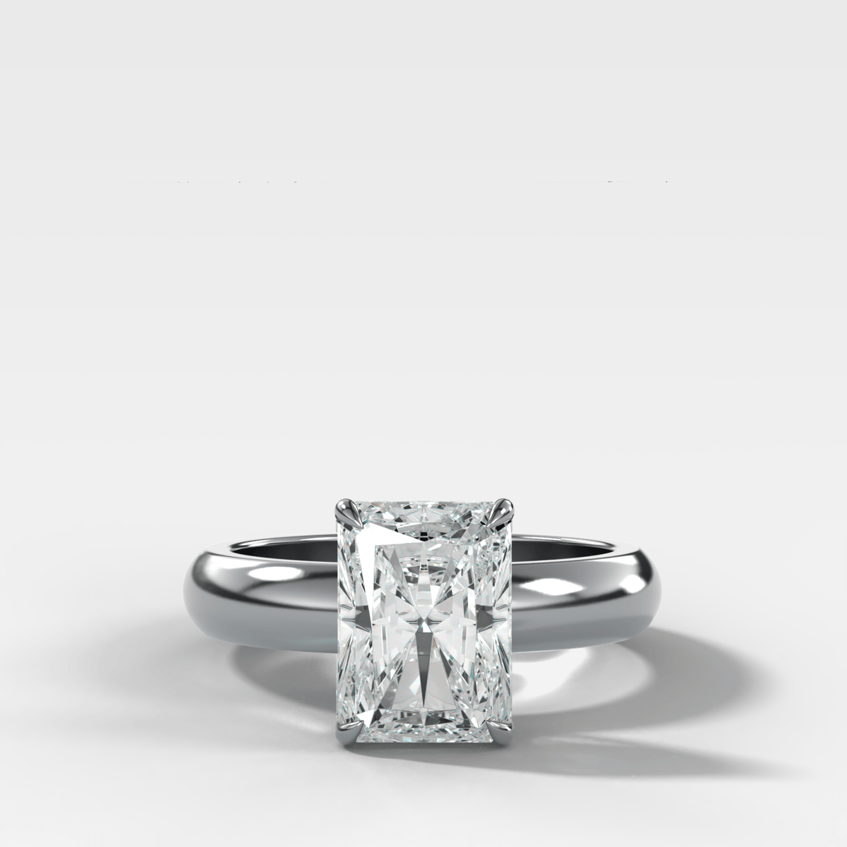 Domed Solitaire Engagement Ring with an Elongated Radiant Cut Diamond - GOODSTONE