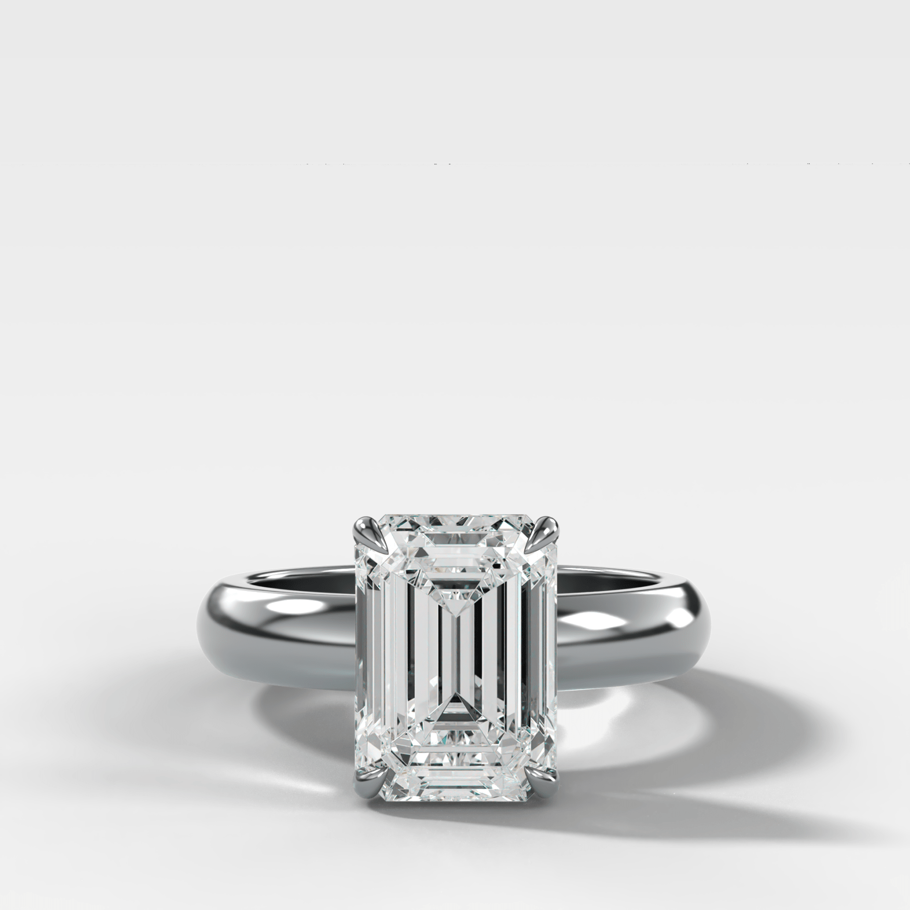 Domed Solitaire Engagement Ring with an Emerald Cut Diamond - GOODSTONE