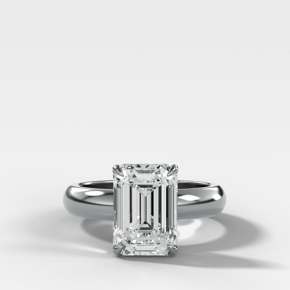 Domed Solitaire Engagement Ring with an Emerald Cut Diamond - GOODSTONE