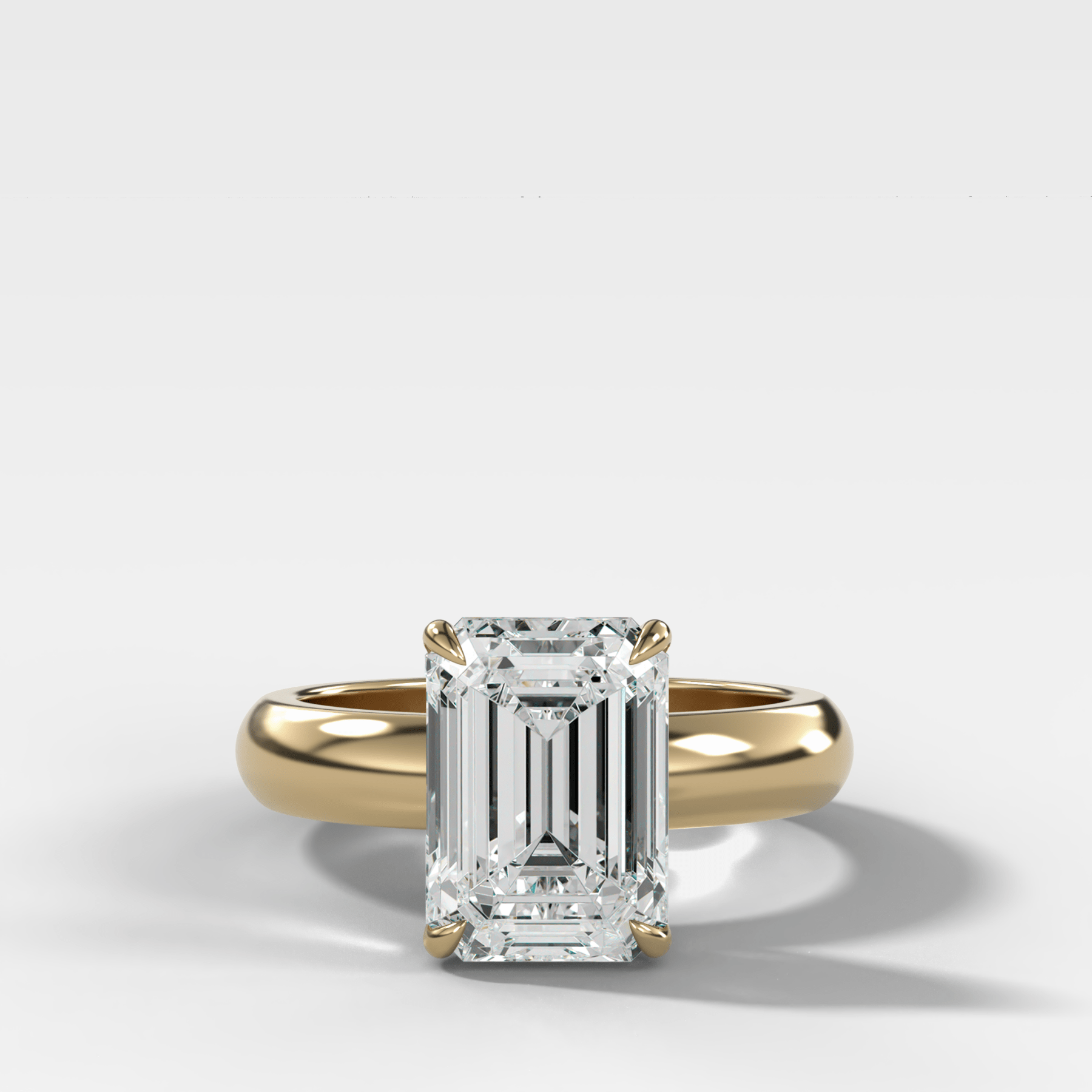 Domed Solitaire Engagement Ring with an Emerald Cut Diamond - GOODSTONE