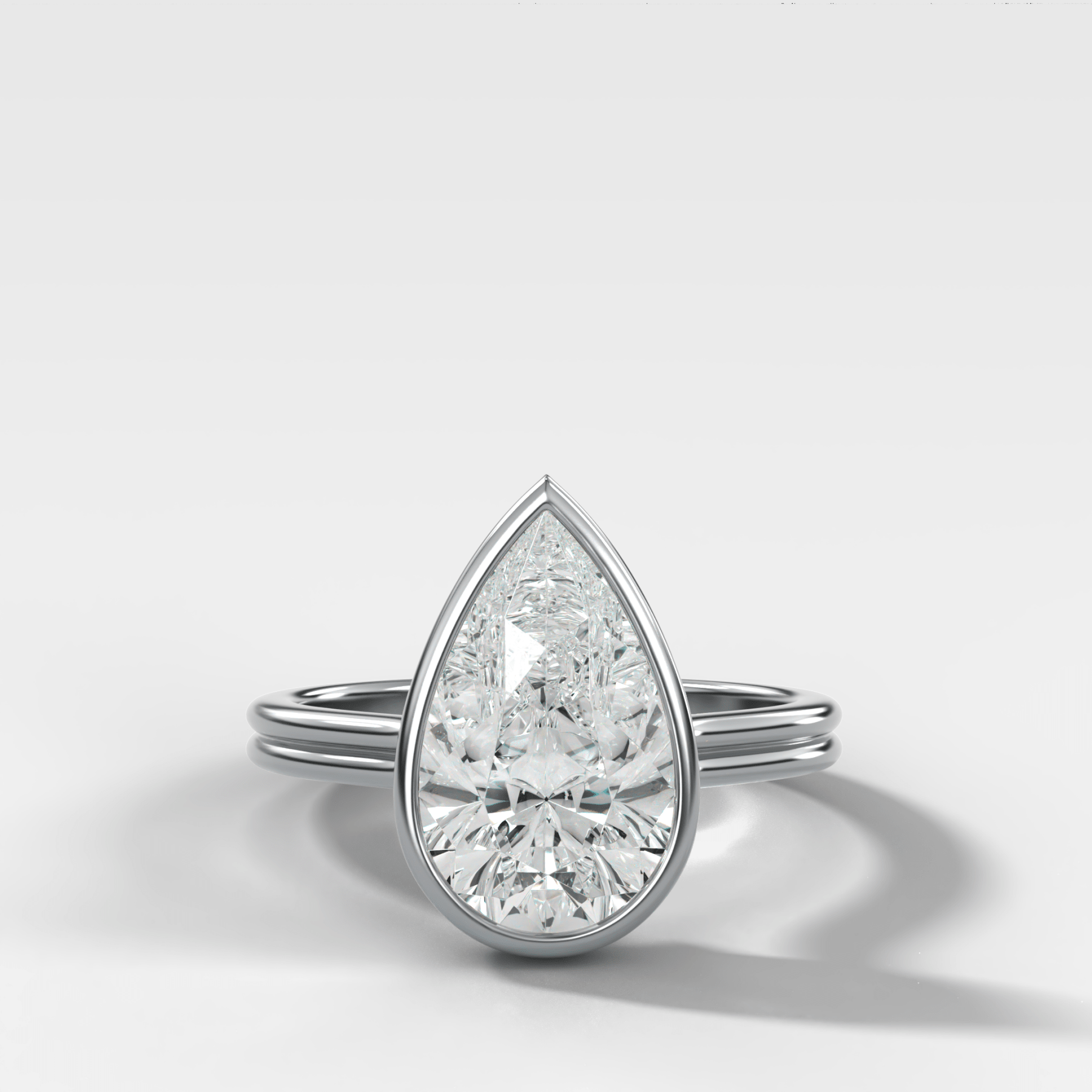 Double Row Penumbra Bezel Engagement Ring With Pear Cut Diamond - GOODSTONE